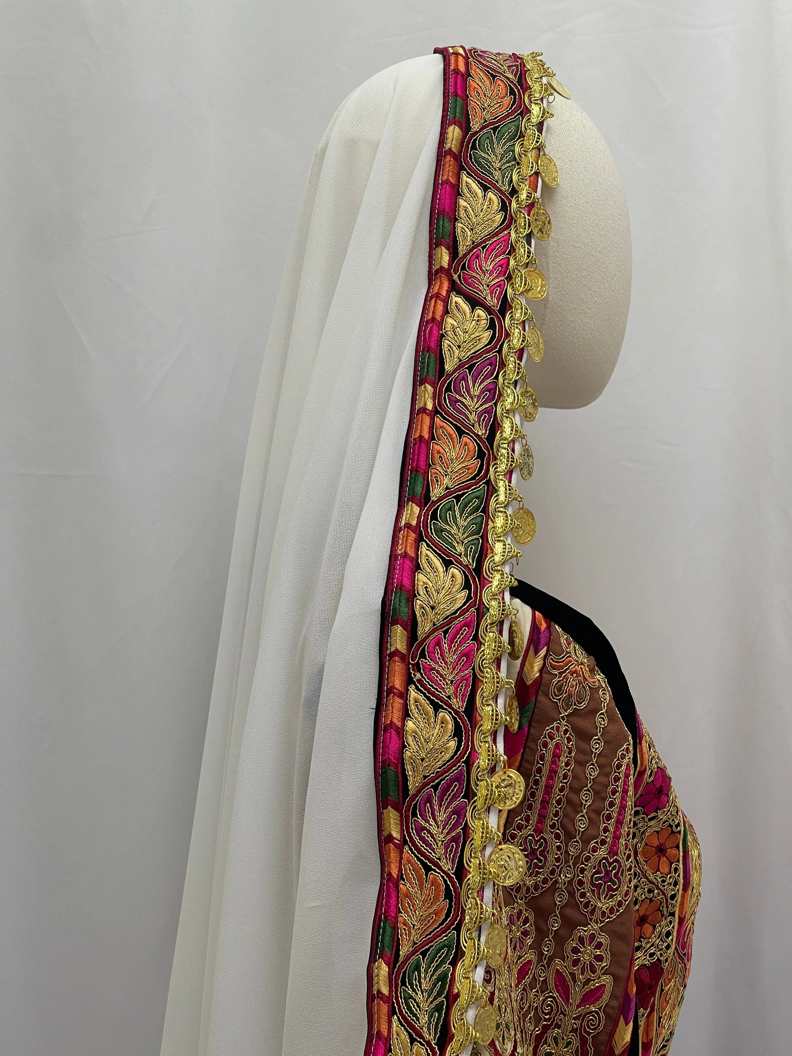 Side view of Malika Queen Emerald Thobe featuring intricate embroidery and elegant design details