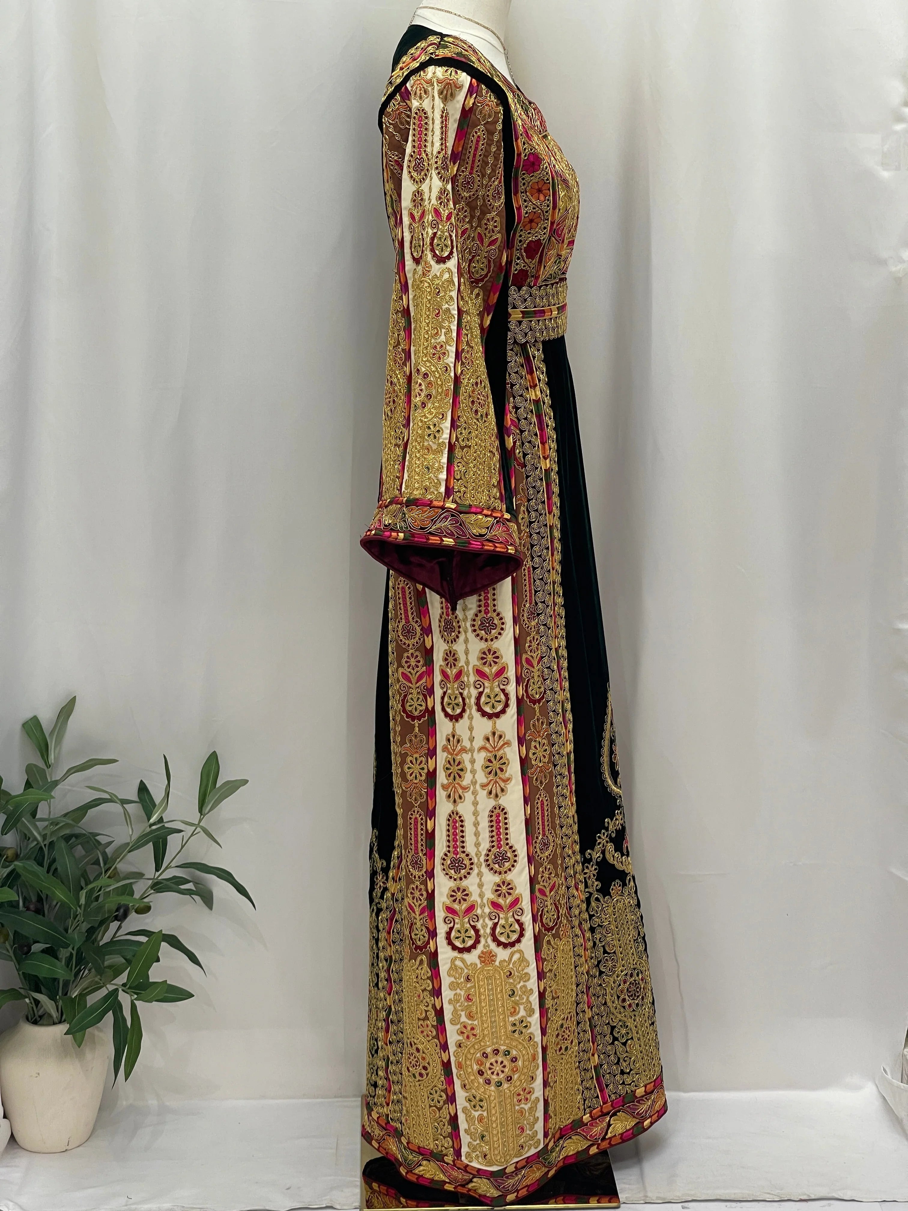 Malika Queen Emerald Thobe featuring intricate embroidery and a flowing silhouette for elegant occasions