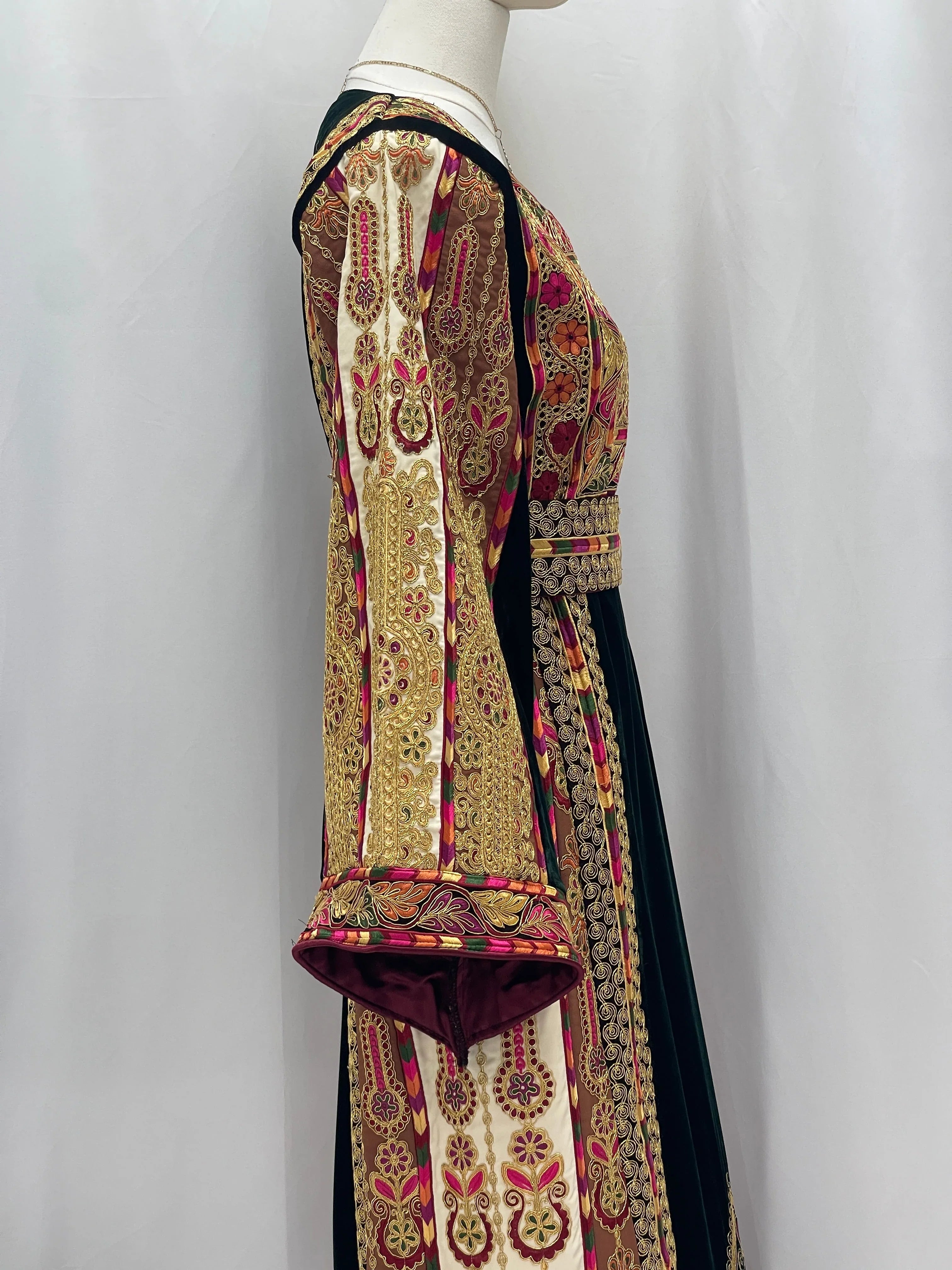 Side view of Malika Queen Emerald Thobe with intricate embroidery and vibrant colors