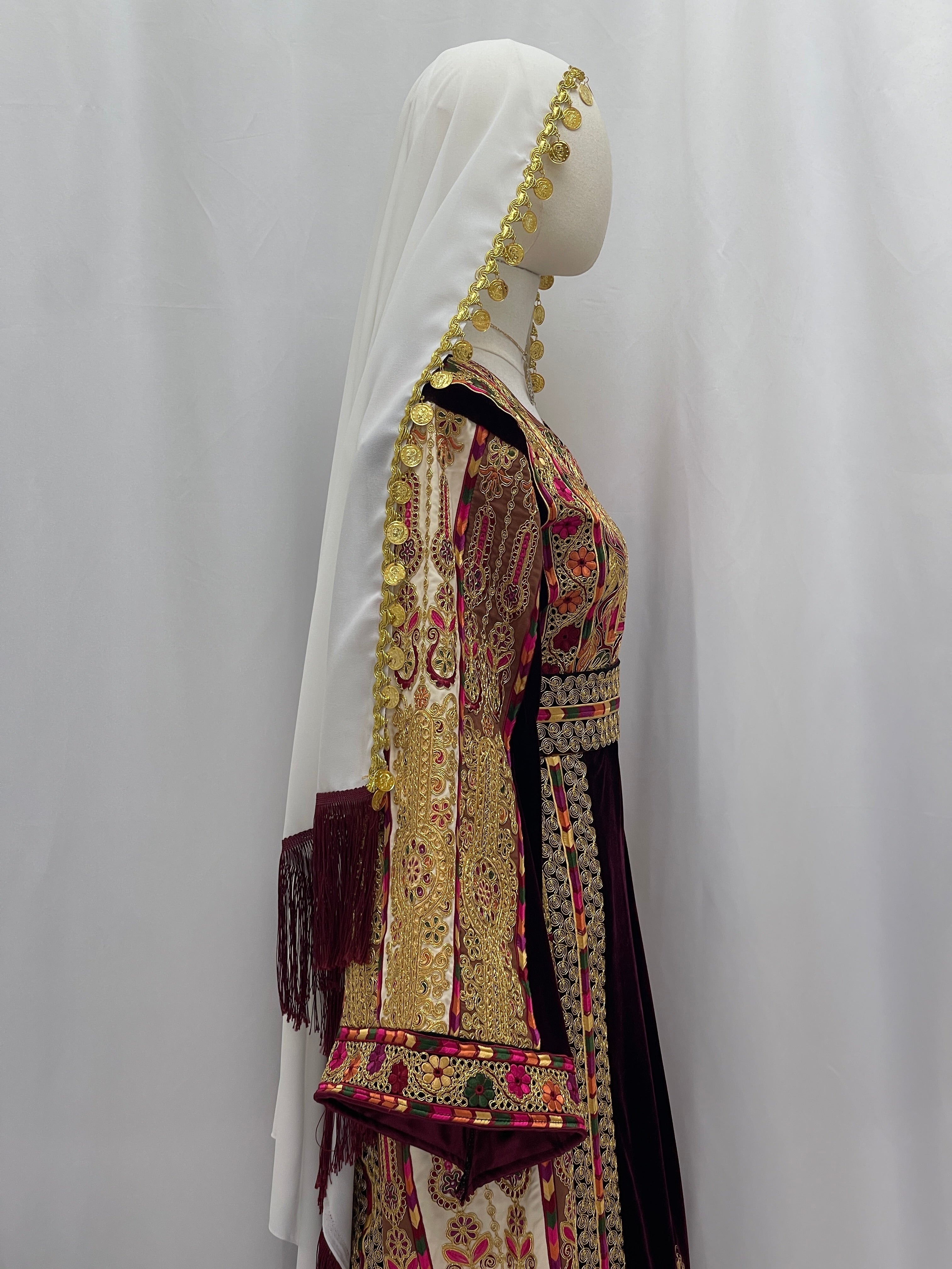 Malikat al-Turath Thoub with intricate embroidery and matching hijab, showcasing Palestinian elegance