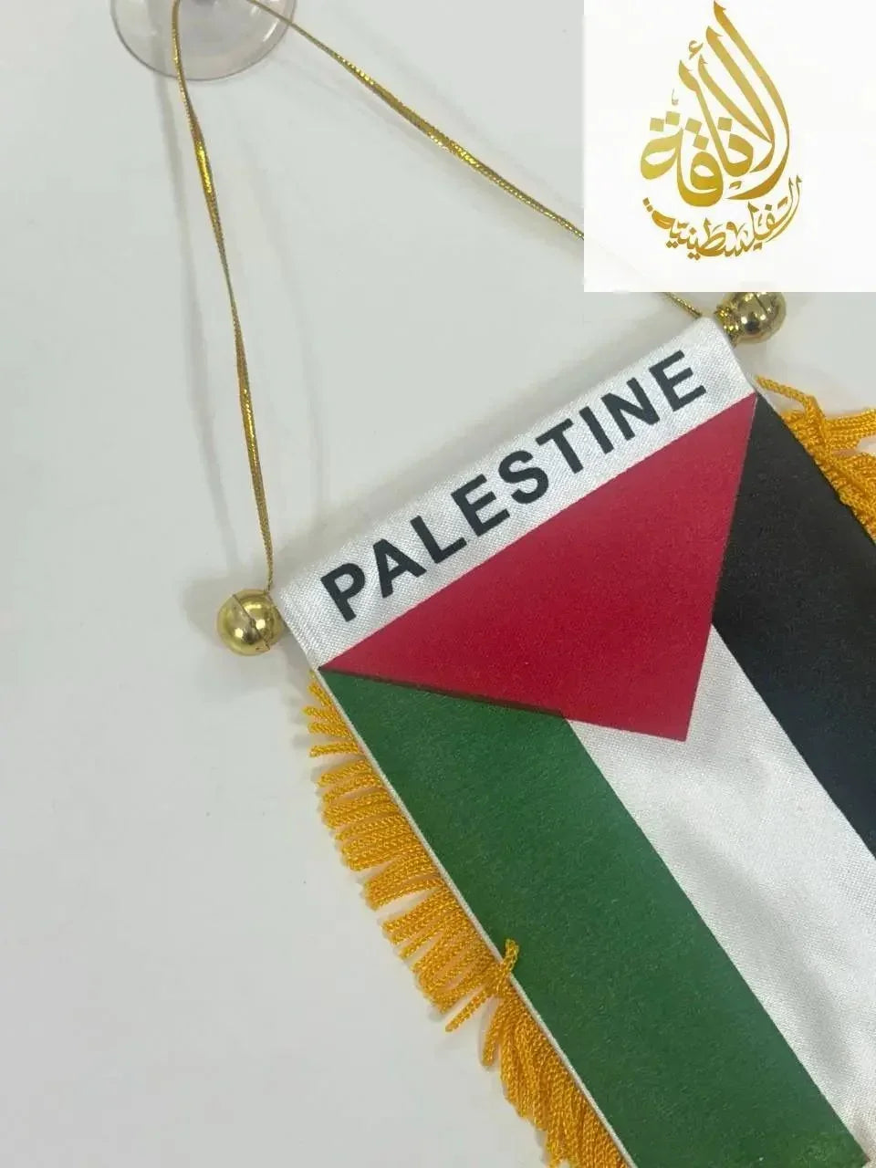 Palestine Mini Pennant Banner by Palestinian Elegance with red, green, black, and white colors and gold tassels