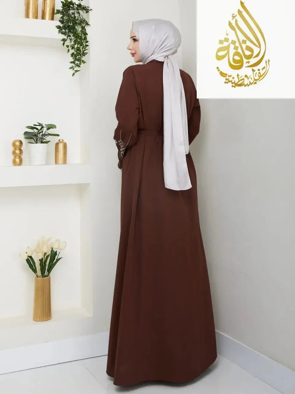 Palestinian Elegance modern open abaya in brown with long sleeves worn with a white hijab