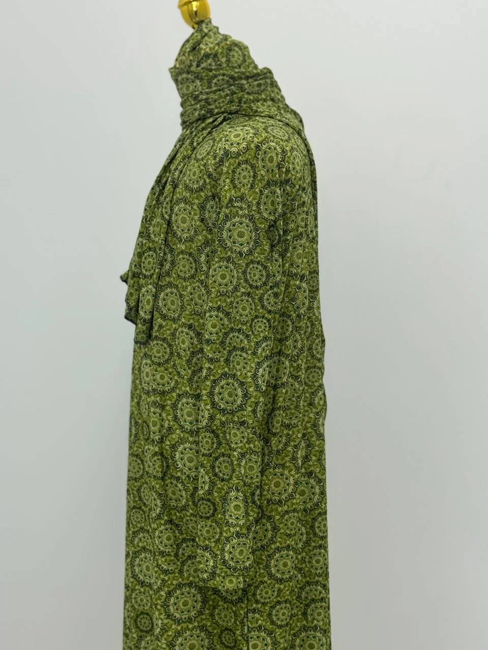 Palestinian Elegance green patterned Full Prayer Dress with matching headscarf displayed on mannequin side view