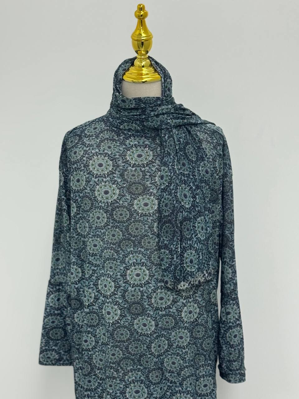 Palestinian Elegance Full Prayer Dress in teal geometric medallion pattern with matching headscarf on mannequin