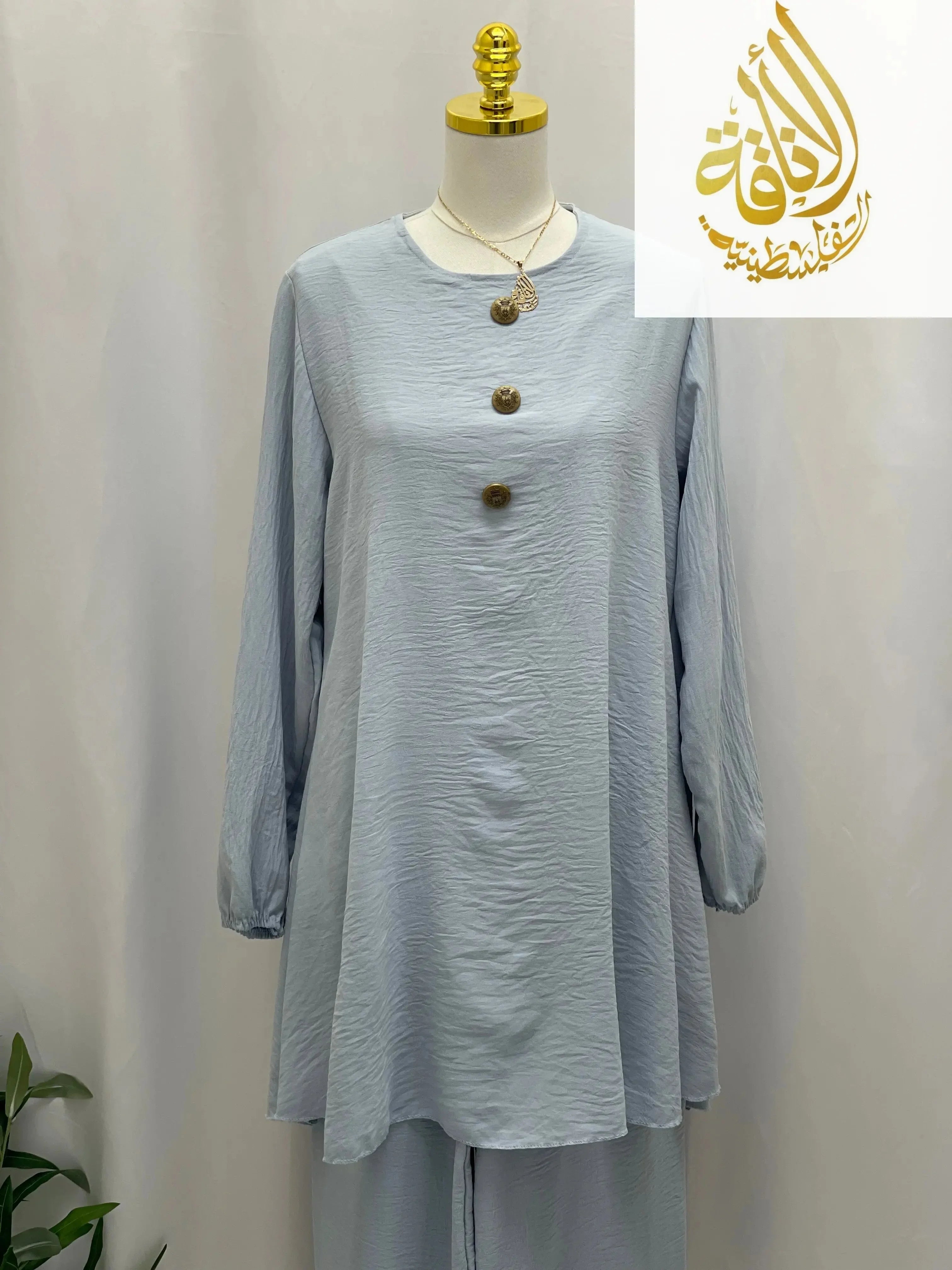 Palestinian Elegance modest long tunic and pant set in light blue with long sleeves and decorative buttons