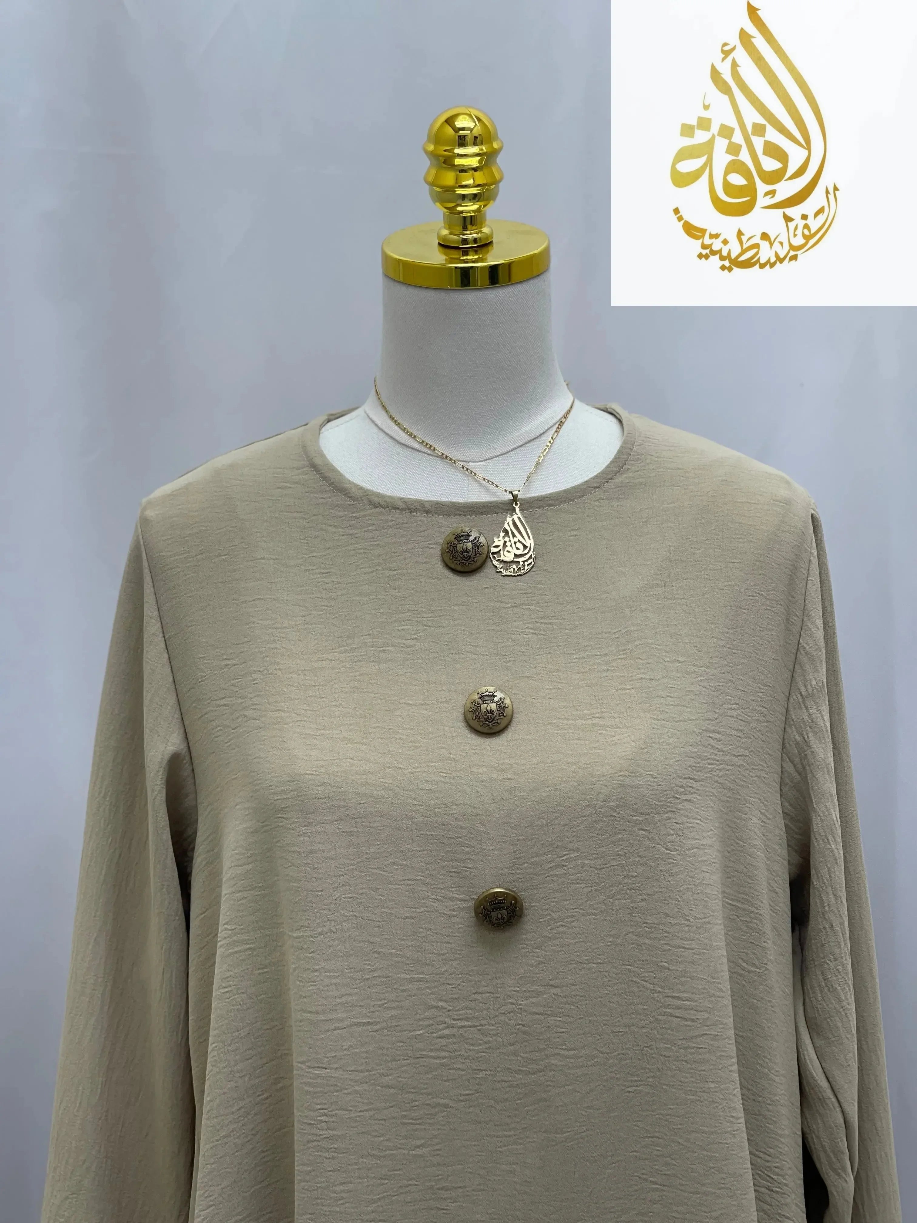 Beige modest long tunic and pant set from Palestinian Elegance with button details on casual fabric