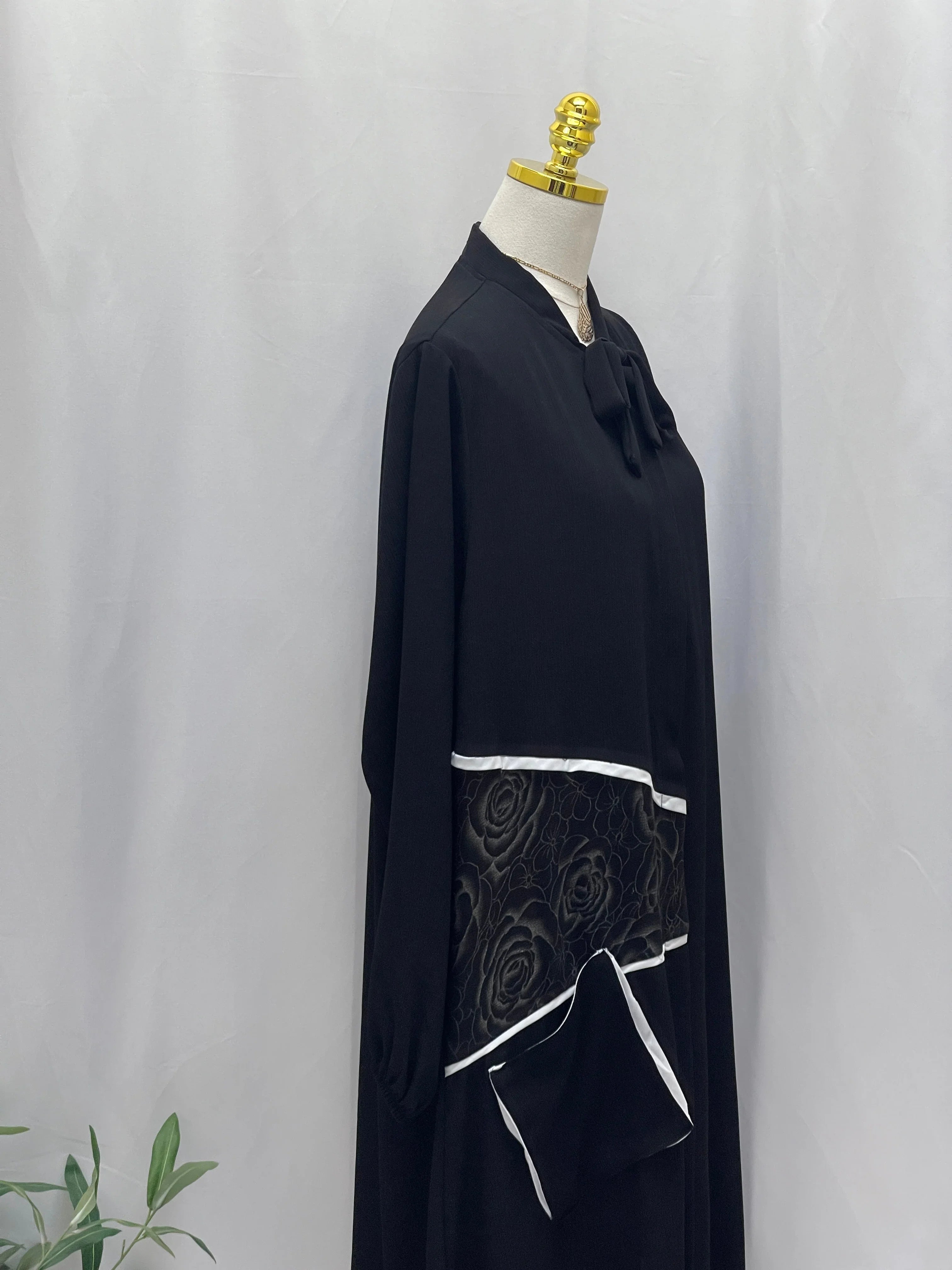 Palestinian Elegance black Modesty Long Set with floral embroidered panel white trim bow neckline and pocket