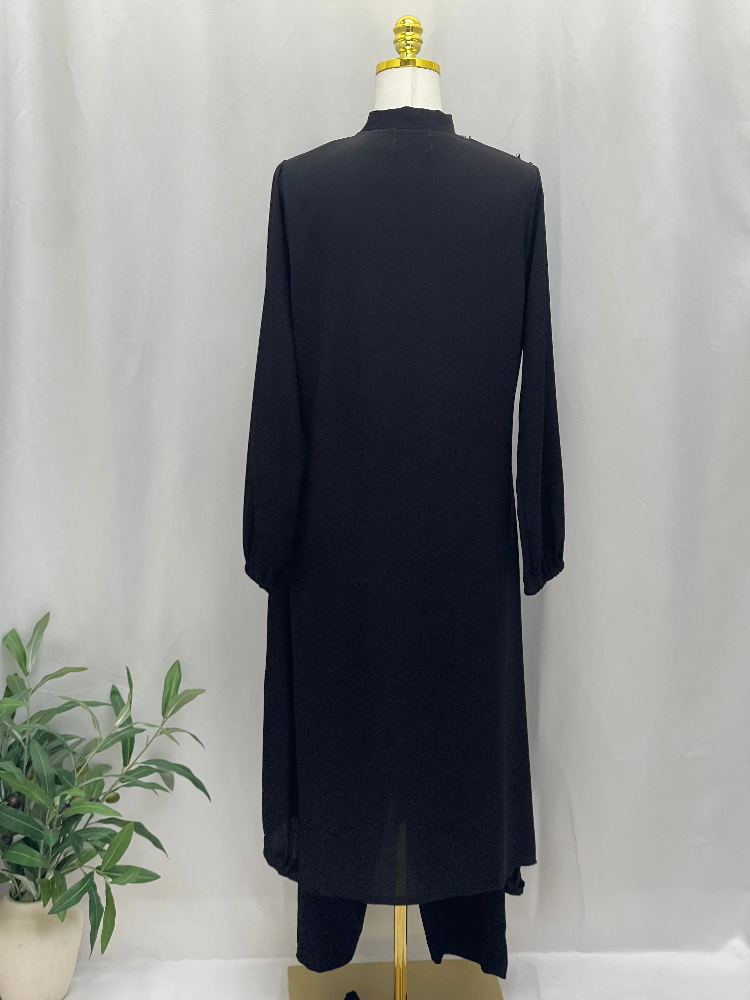 Palestinian Elegance Modesty Long Set black long tunic and matching wide leg pants back view on mannequin