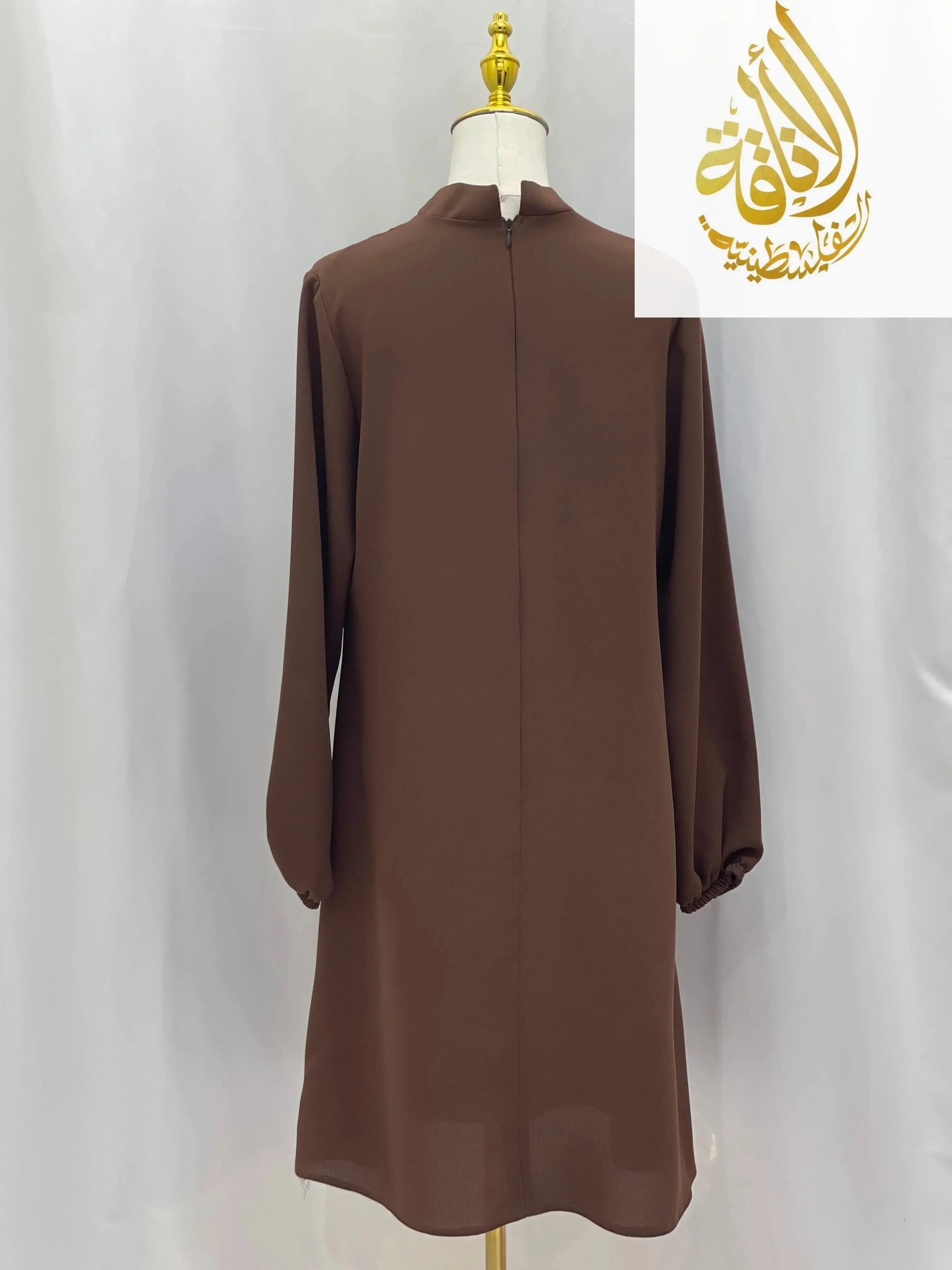 Back view of modest embroidered tunic dress in brown with long sleeves from Palestinian Elegance