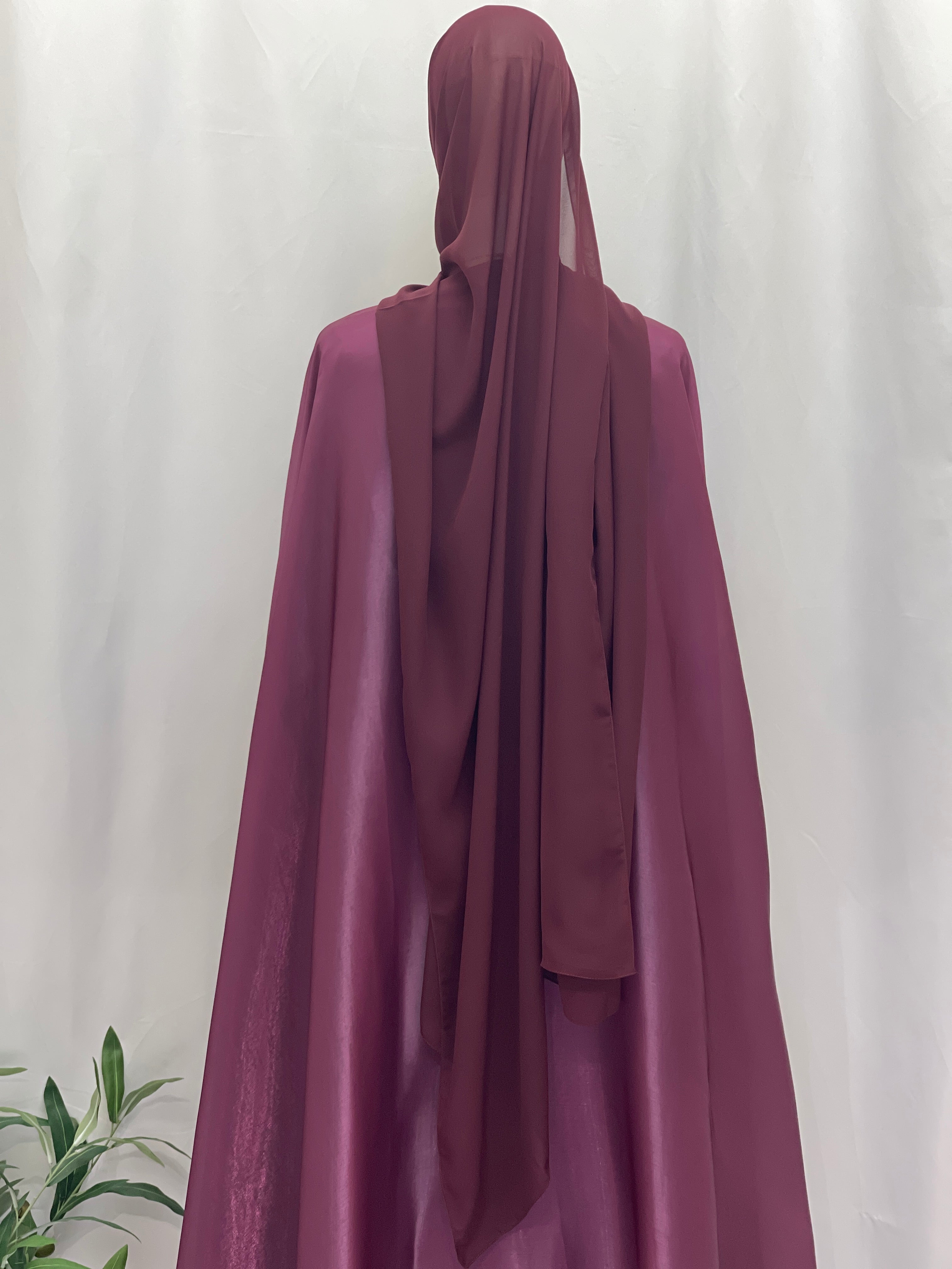 Back view of a purple Moonlit Organza Abaya by Palestinian Elegance with a matching headscarf
