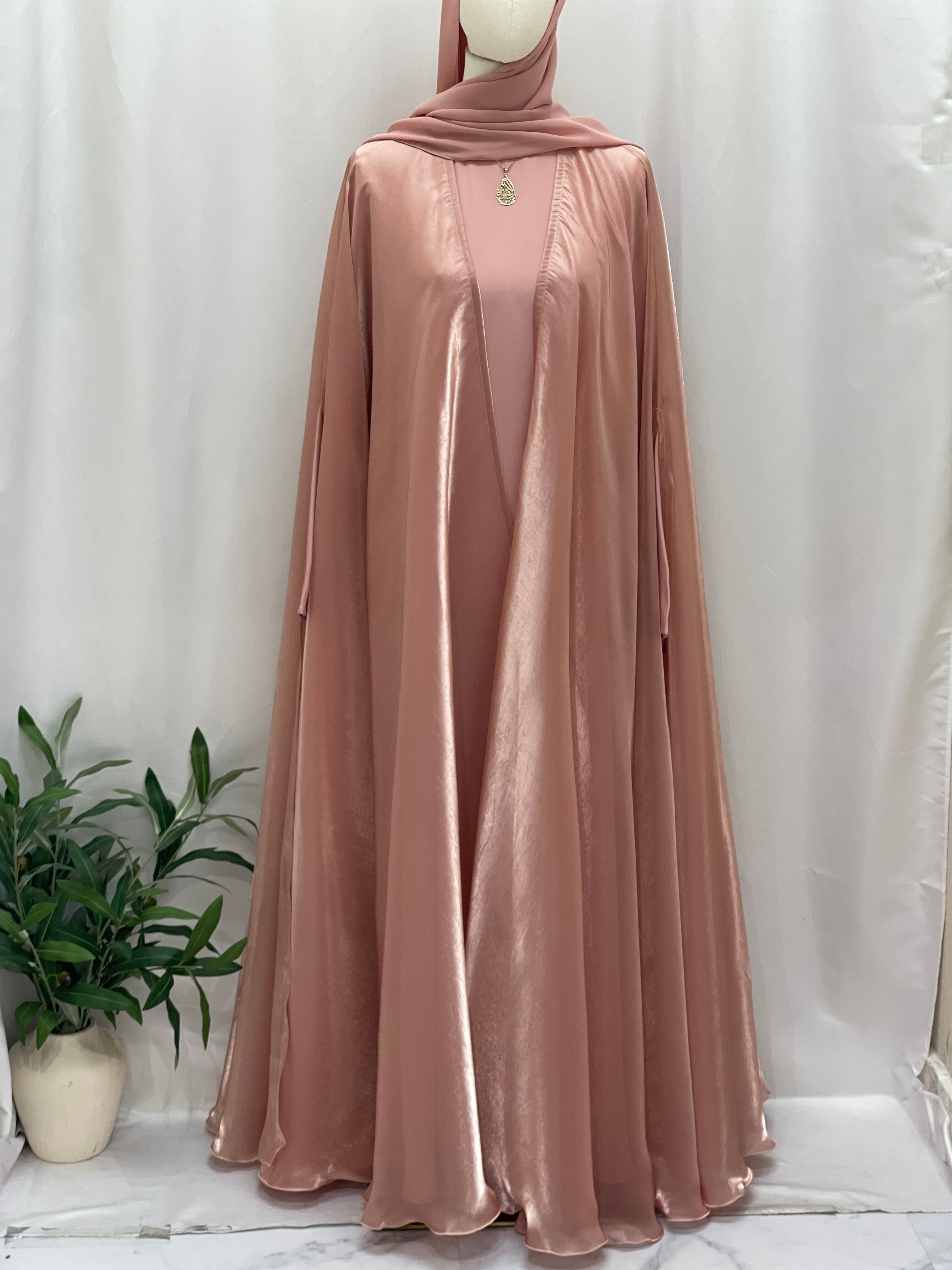 Palestinian Elegance Moonlit Organza Abaya in soft pink flowy fabric with matching hijab displayed on mannequin