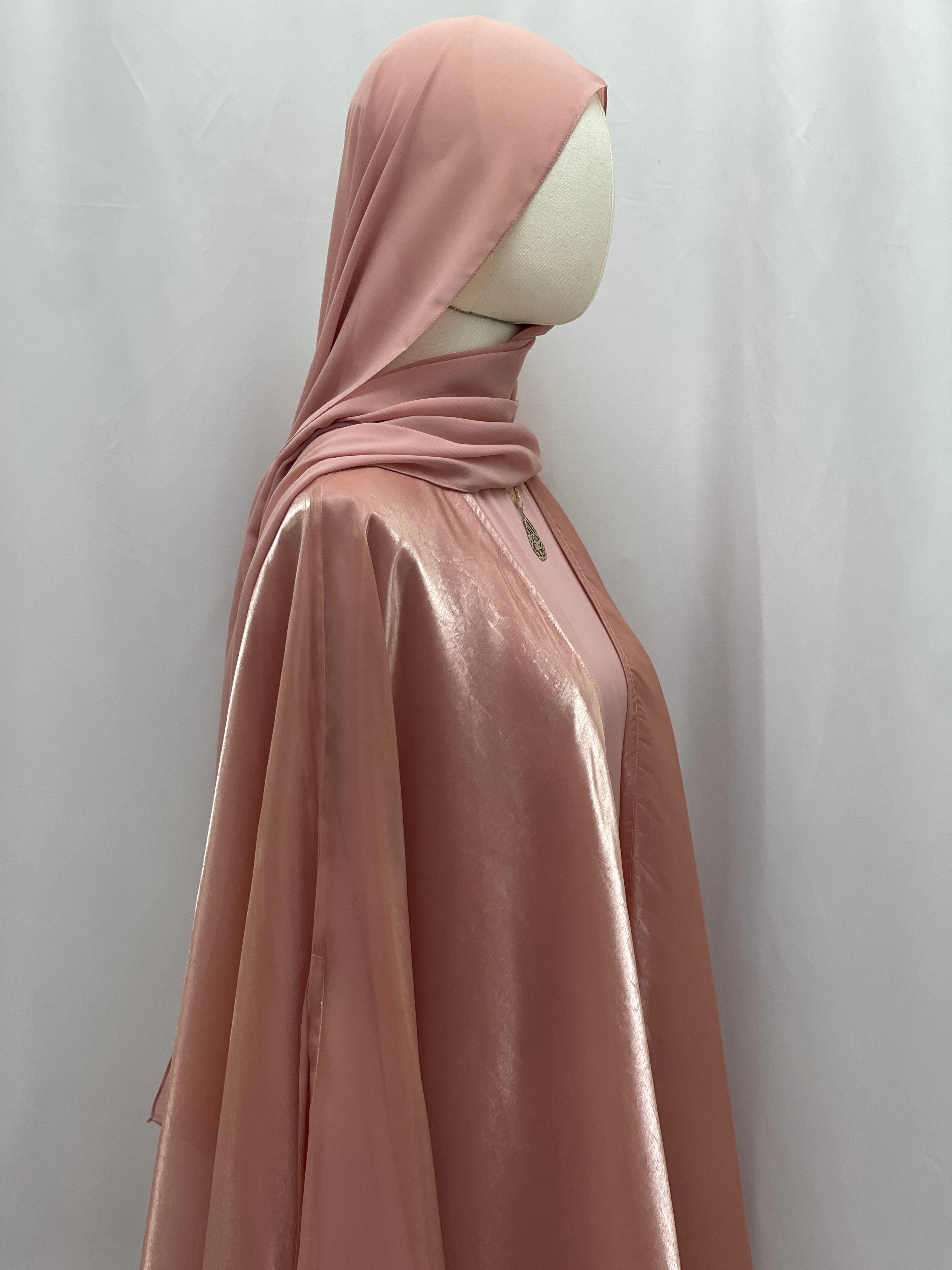 Palestinian Elegance Moonlit Organza Abaya in soft pink satin fabric with matching hijab on mannequin