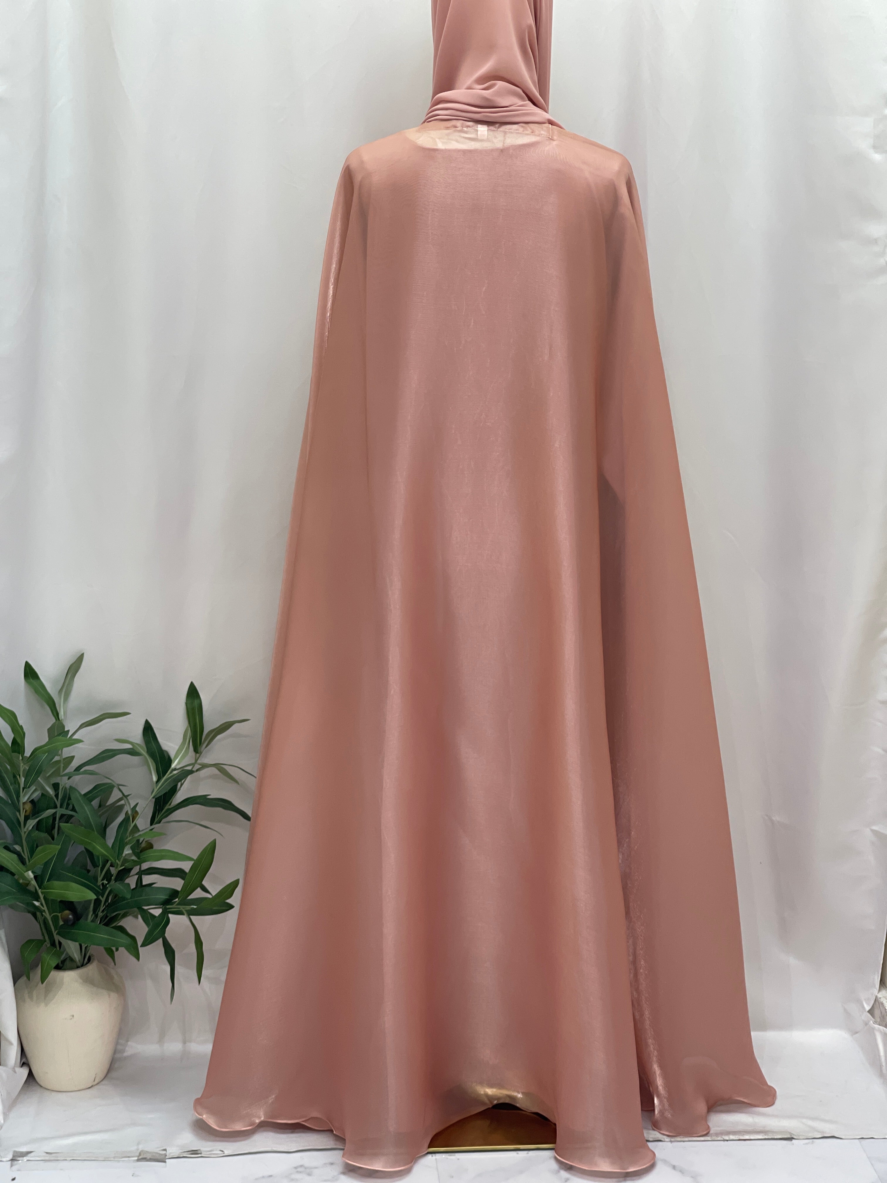 Back view of Palestinian Elegance Moonlit Organza Abaya in soft pink with flowing sheer fabric