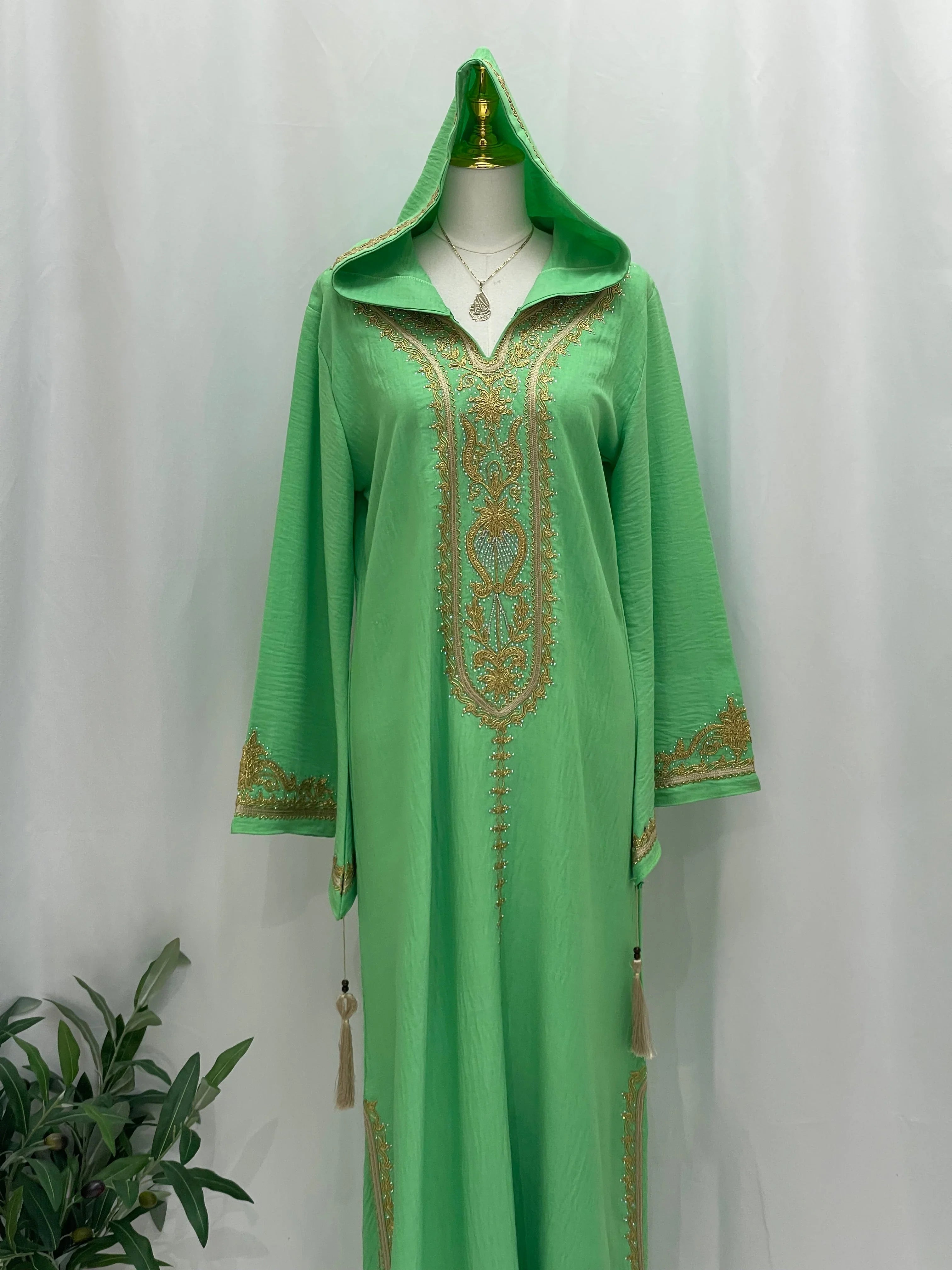 Palestinian Elegance green hooded abaya with gold detailing and tassels Moroccan Embroidered Djellaba