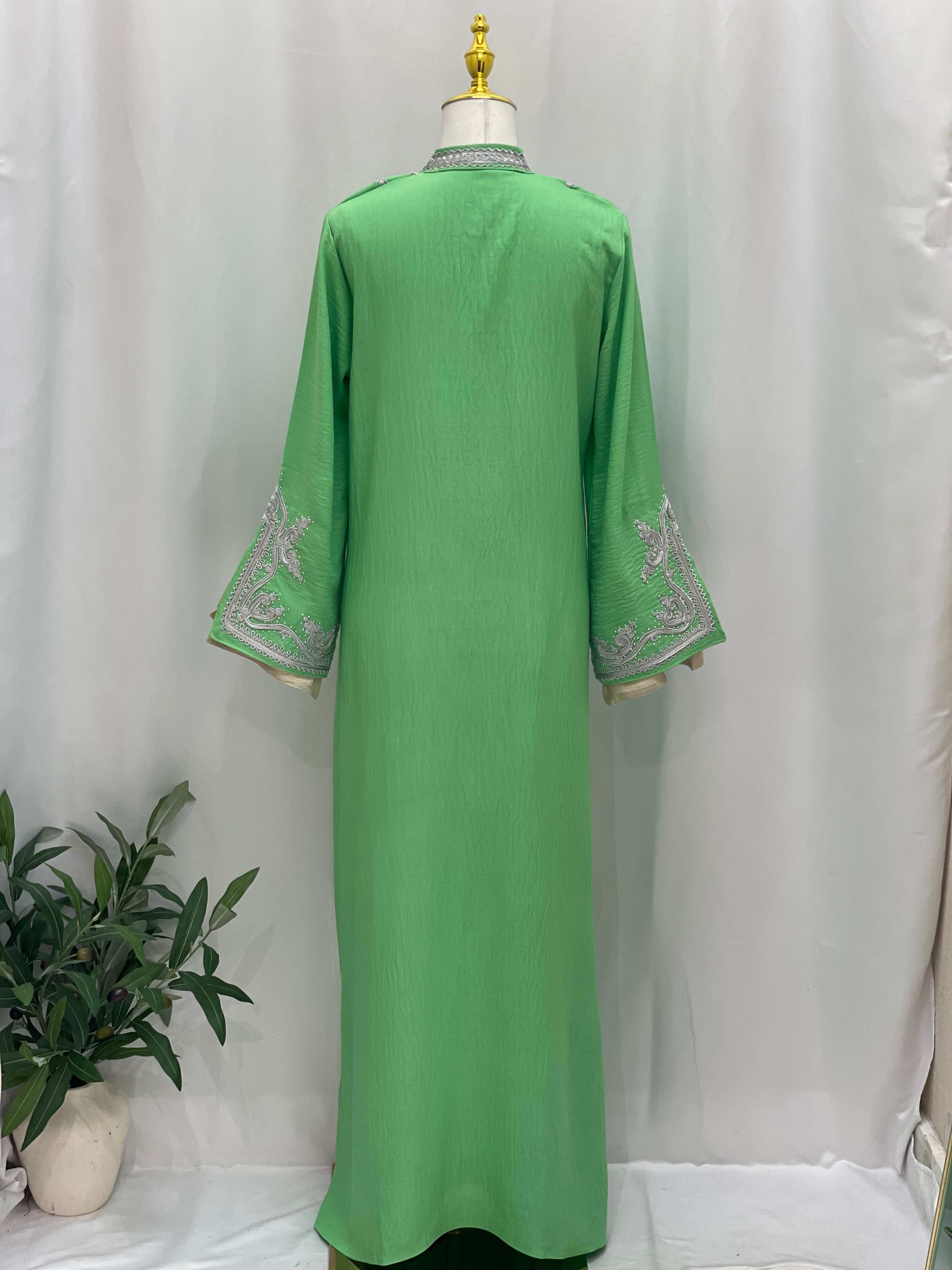 Palestinian Elegance green Moroccan Rana Jalabia abaya with silver embroidery on sleeves and collar
