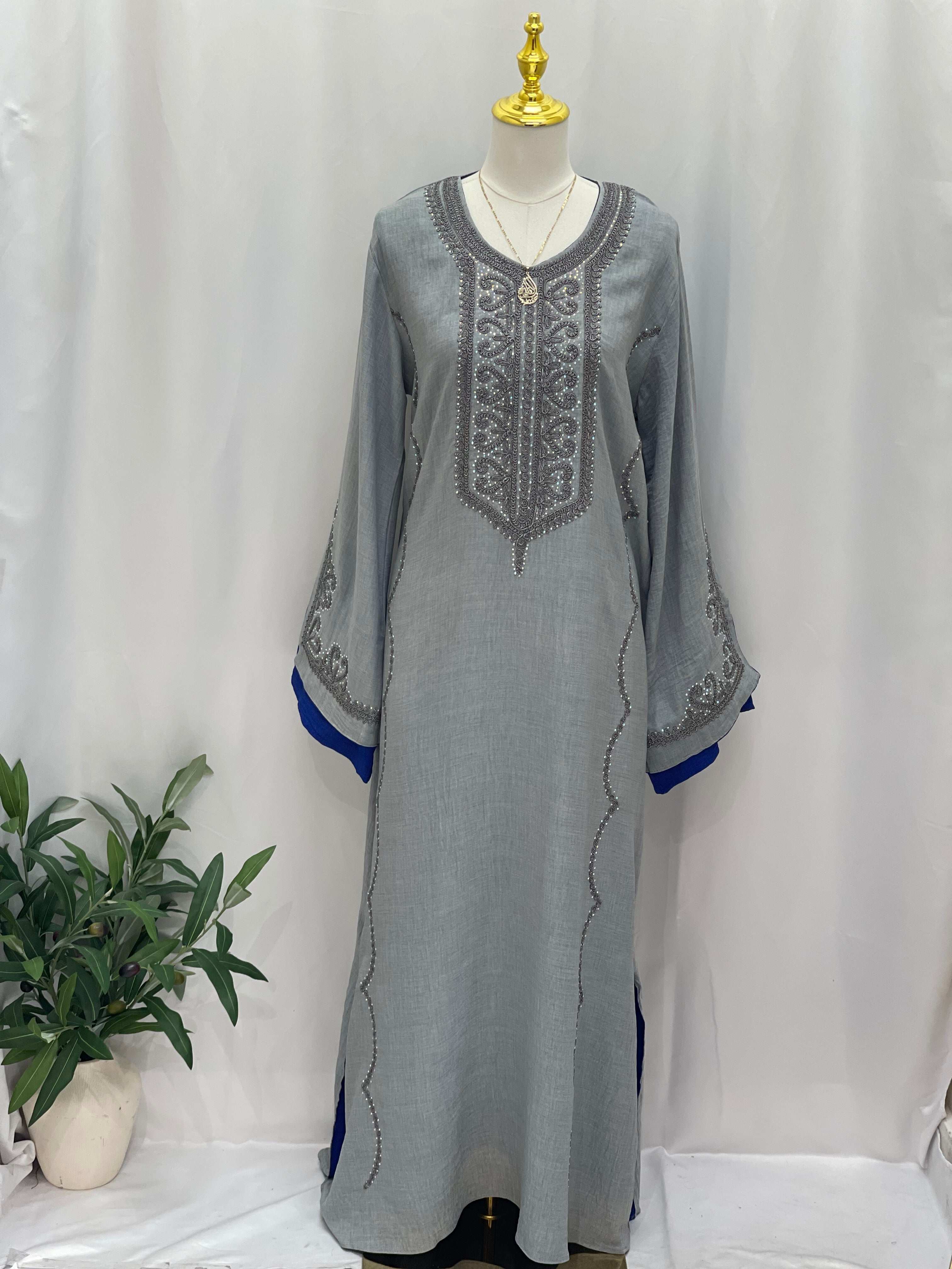 Palestinian Elegance Moroccan Rana Jalabia gray abaya with intricate embroidery and blue sleeve accents