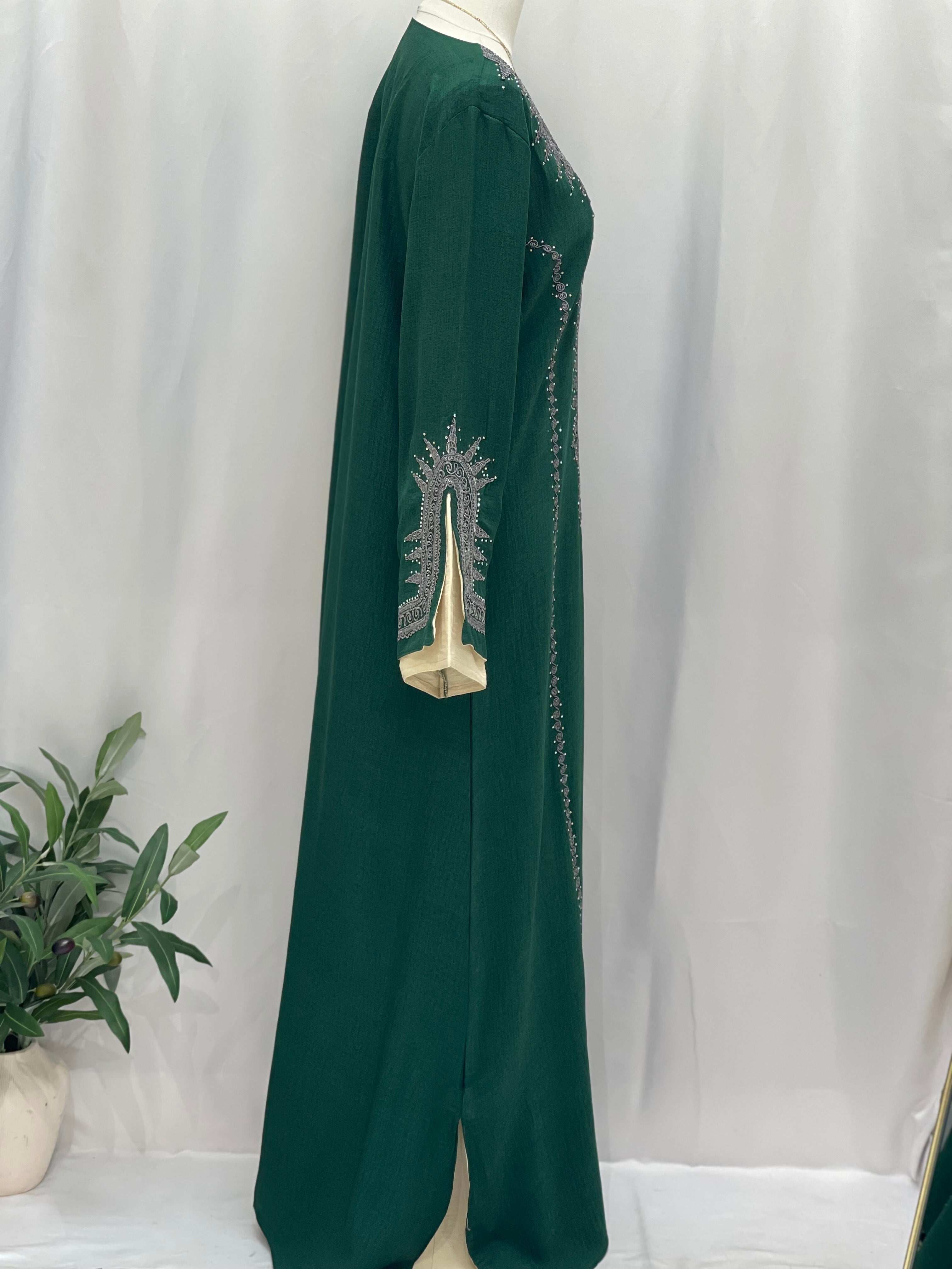 Green Moroccan Salma Jalabia abaya by Palestinian Elegance with intricate sleeve embroidery