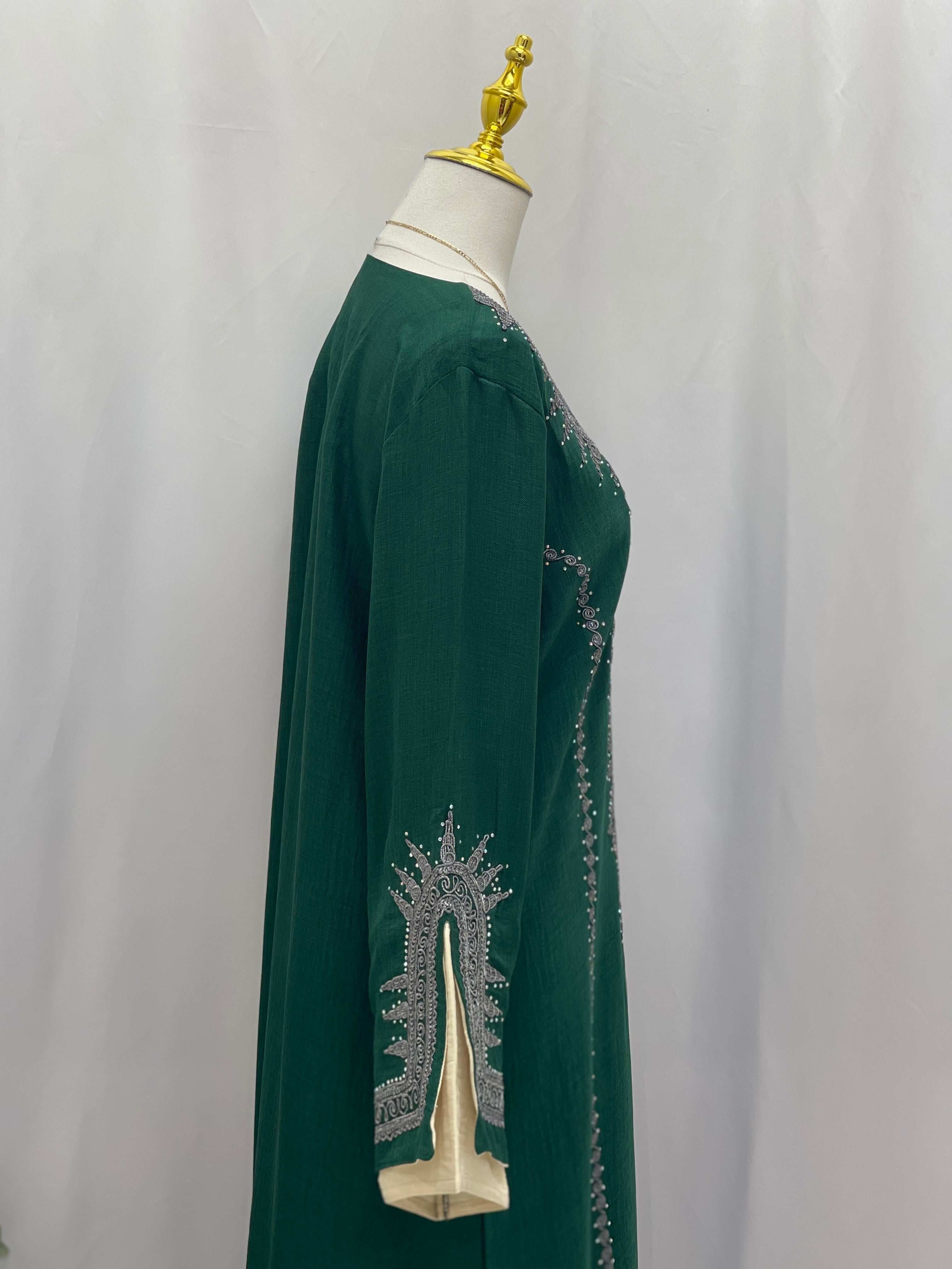 Palestinian Elegance green abaya featuring intricate embroidery on sleeves Moroccan Salma Jalabia design