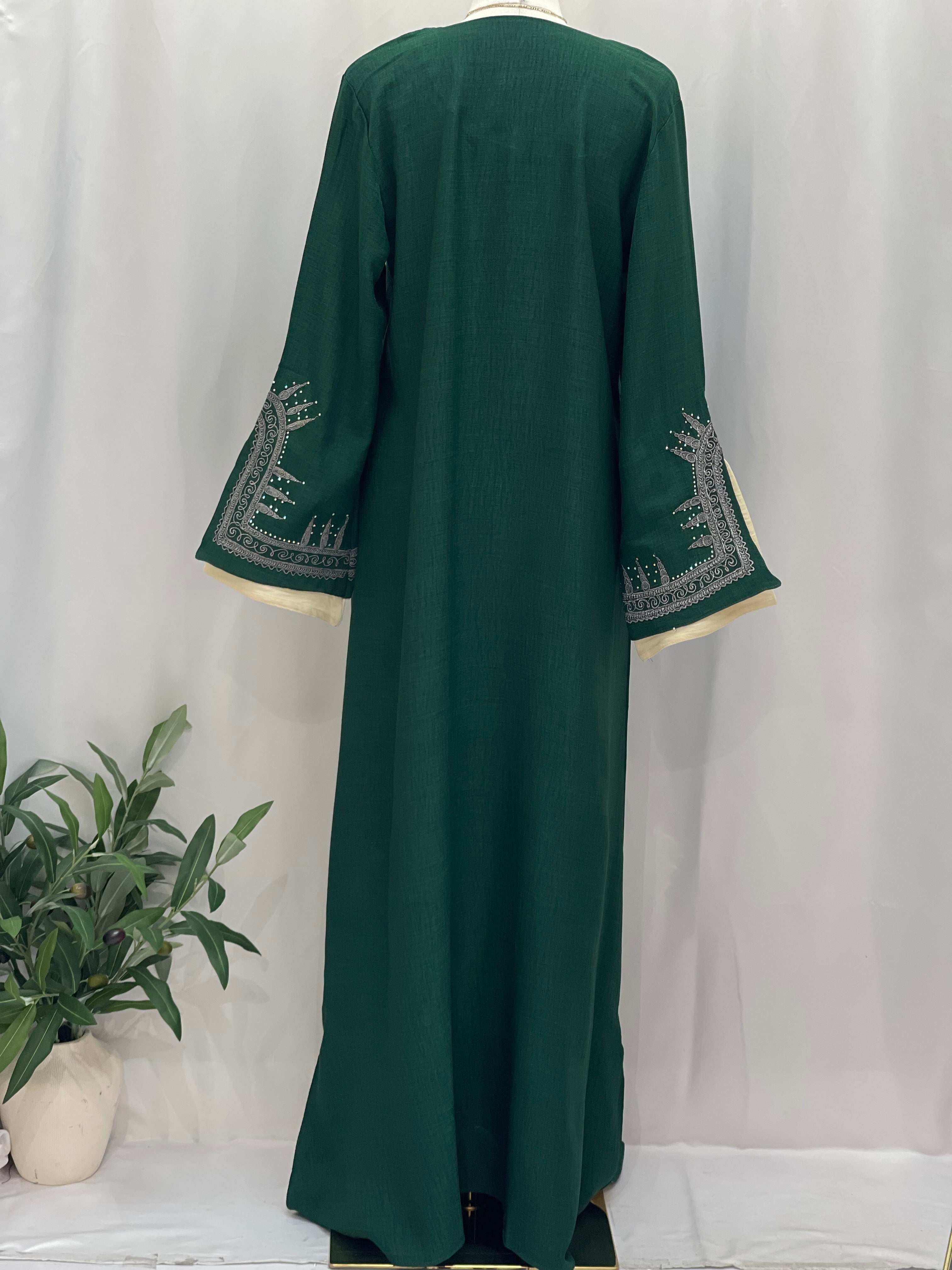 Palestinian Elegance Moroccan Salma Jalabia abaya in deep green with intricate silver sleeve embroidery