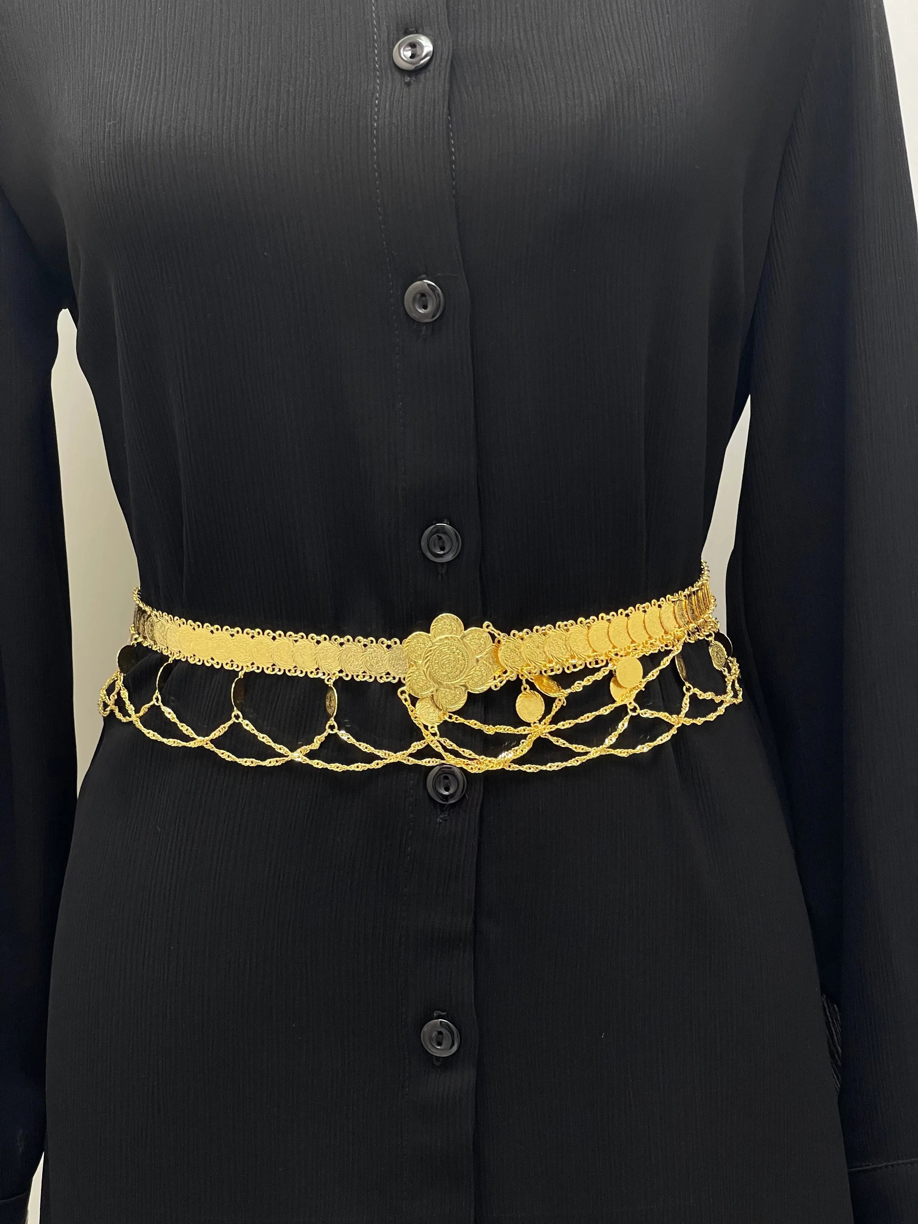 Nada Imitated Gold Floral Belt from Palestinian Elegance on black dress with intricate floral design