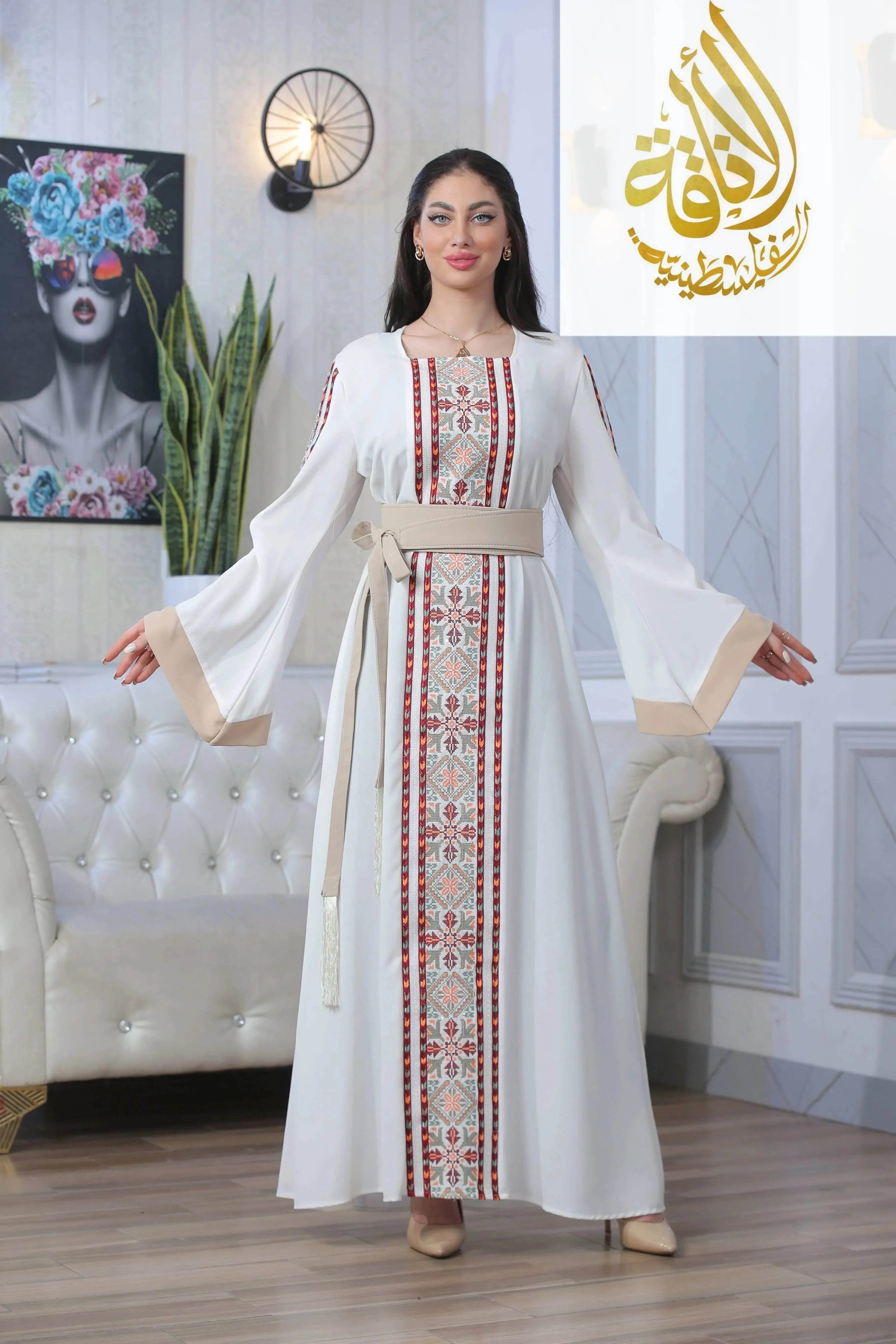 Palestinian Elegance Nadera Embroidered Thoub in white with traditional red and beige embroidery and a matching belt