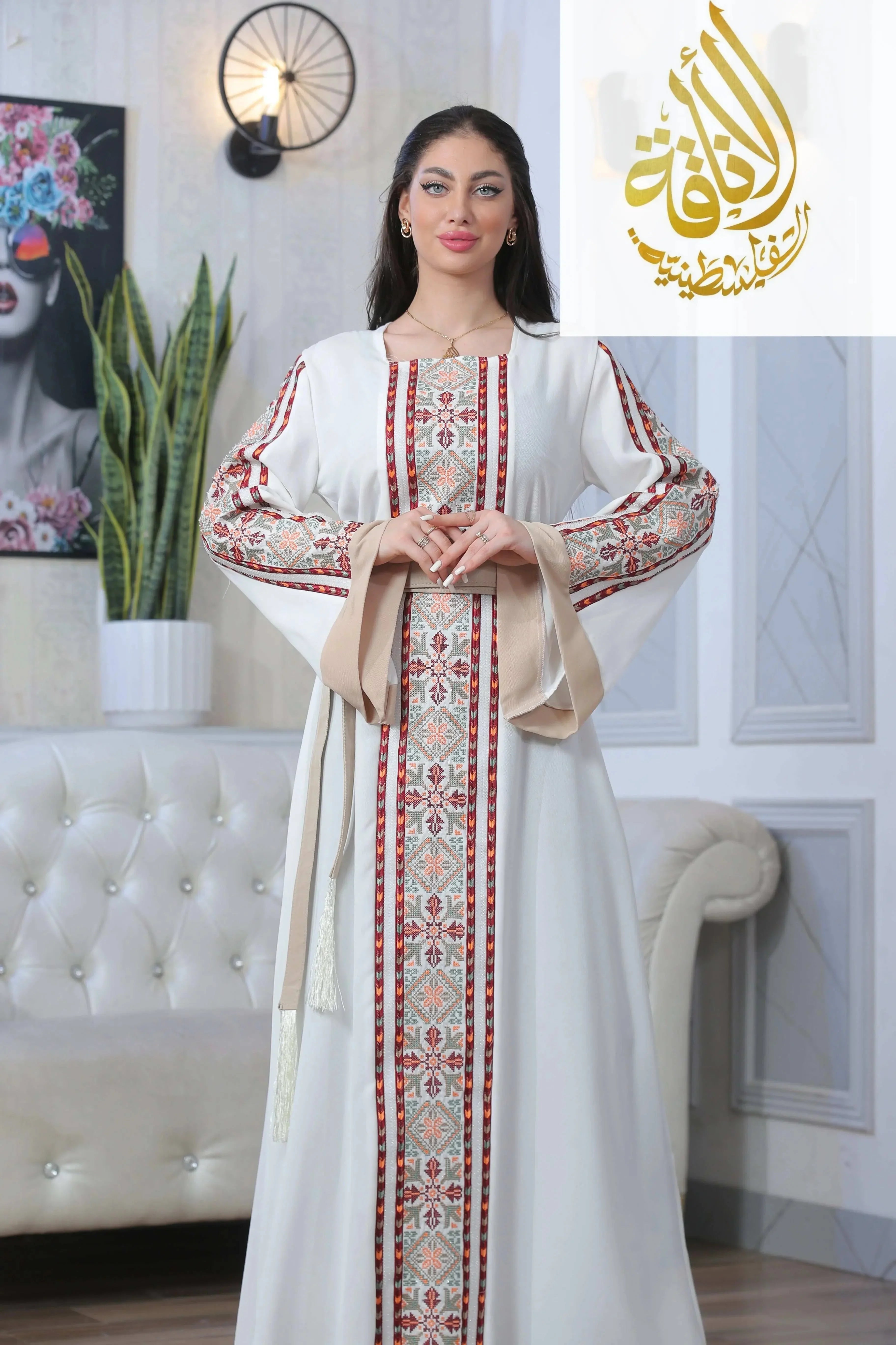 Palestinian Elegance Nadera Embroidered Thoub in white with traditional red and beige embroidery details