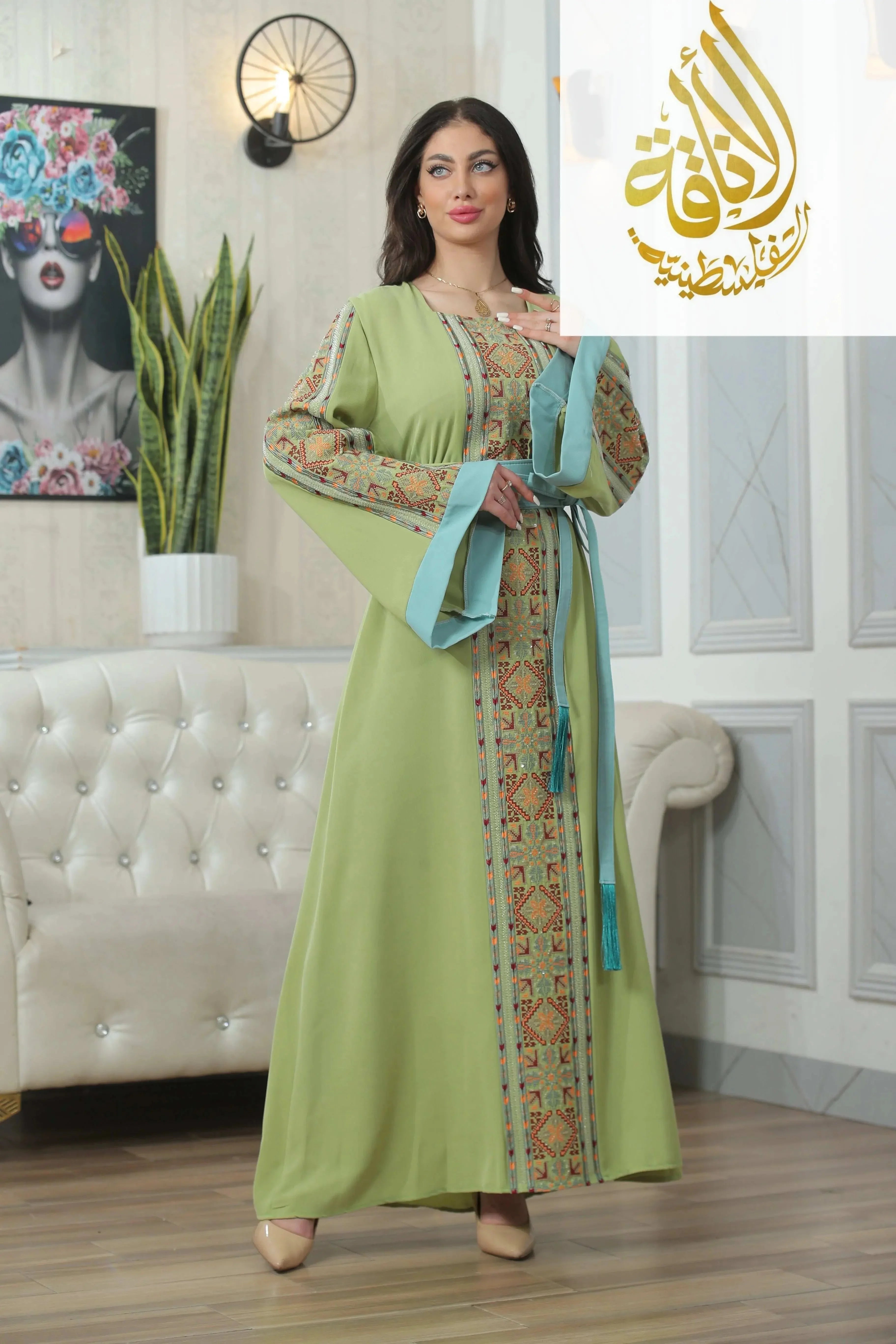 Palestinian Elegance Nadera Embroidered Thoub with green fabric and intricate traditional embroidery