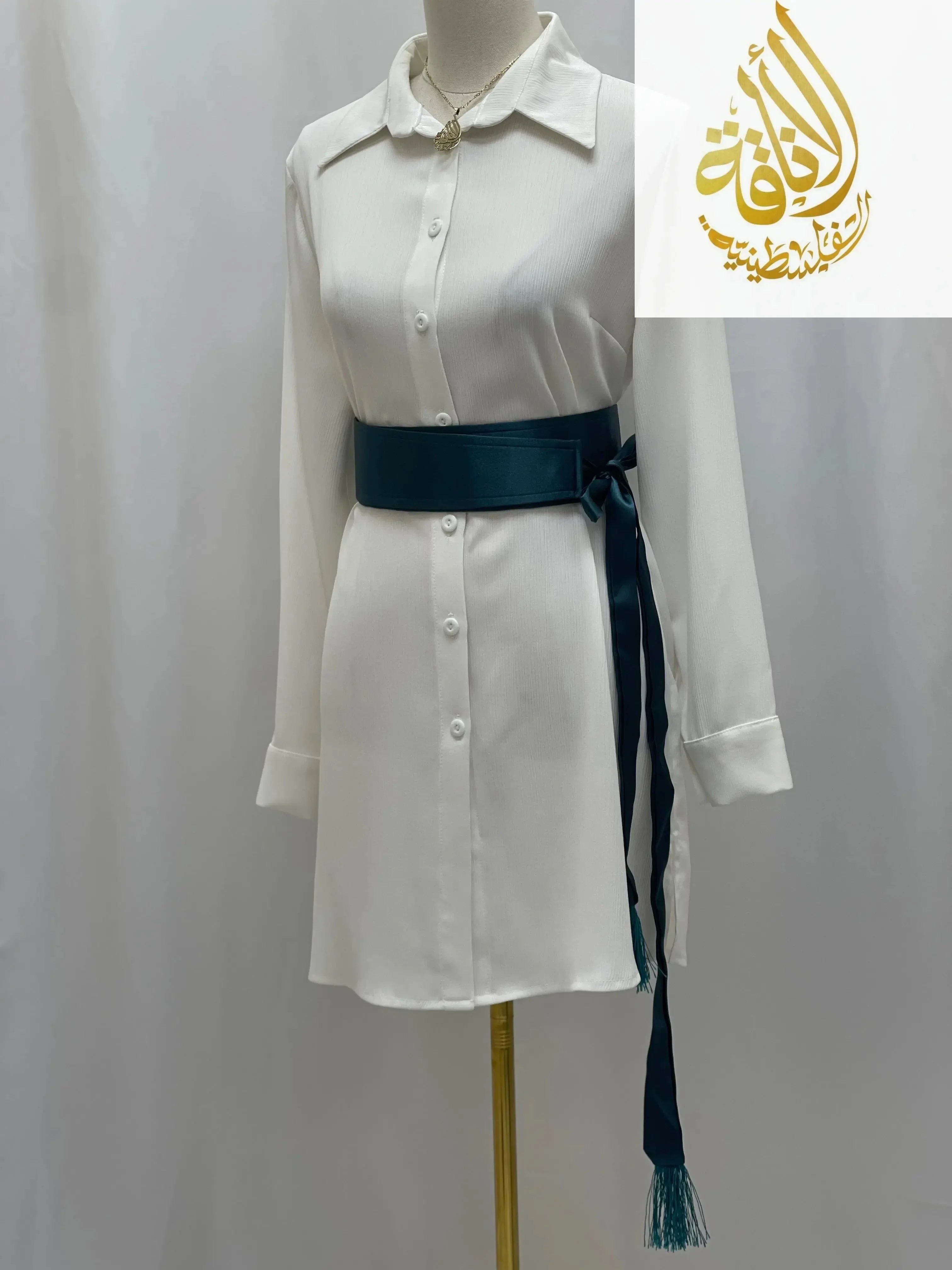 Palestinian Elegance satin belt for dresses in teal blue tied around a white button-down dress