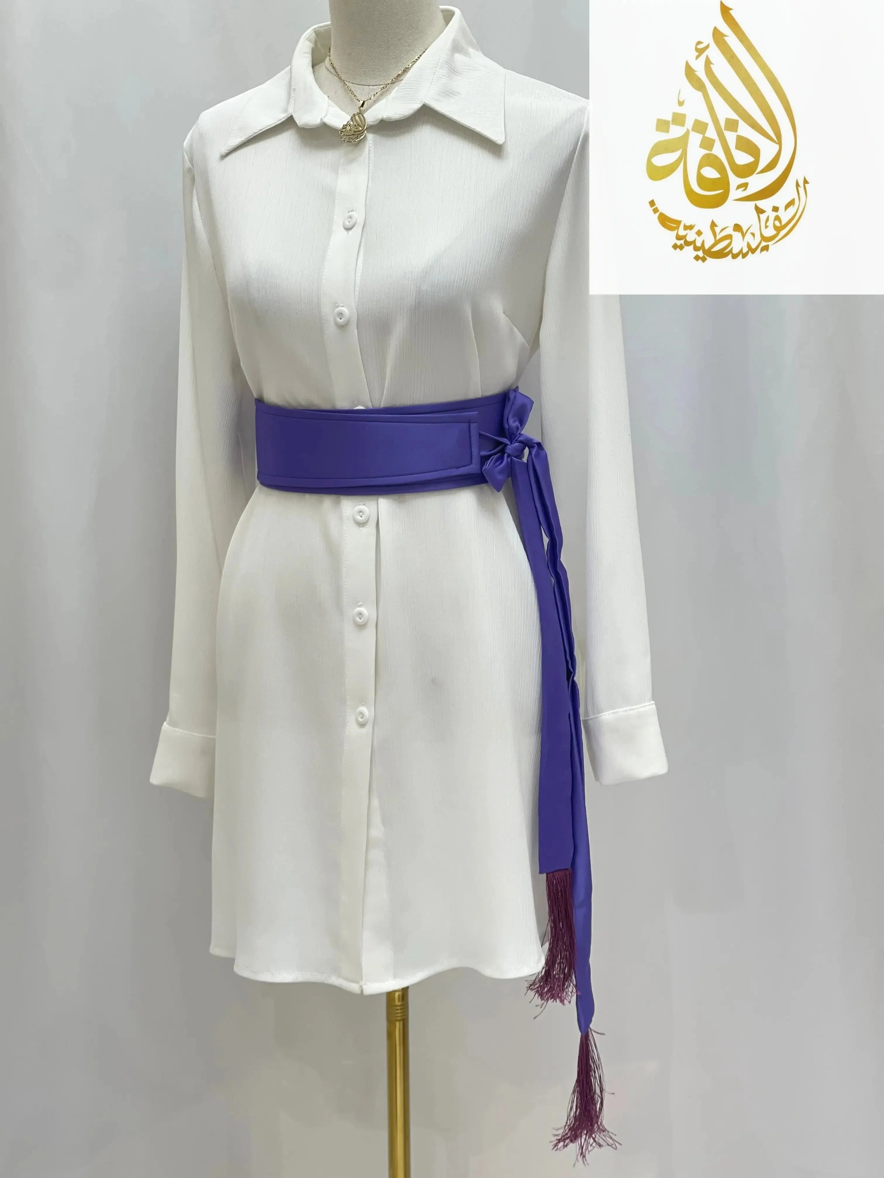 Purple satin belt for dresses by Palestinian Elegance styled on white button-down dress with tassel ends