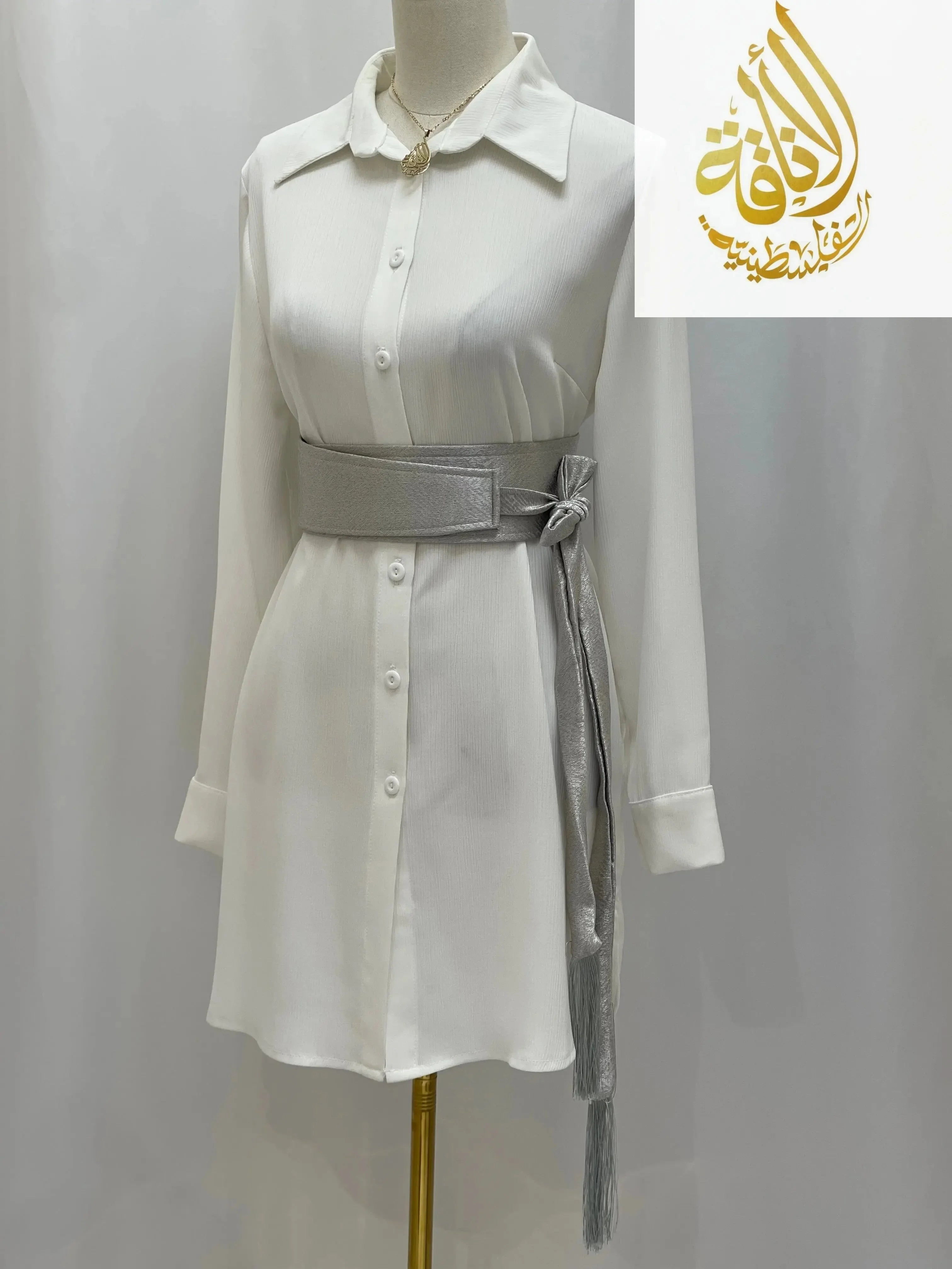 Palestinian Elegance white dress styled with silver satin belt for dresses tied at the waist