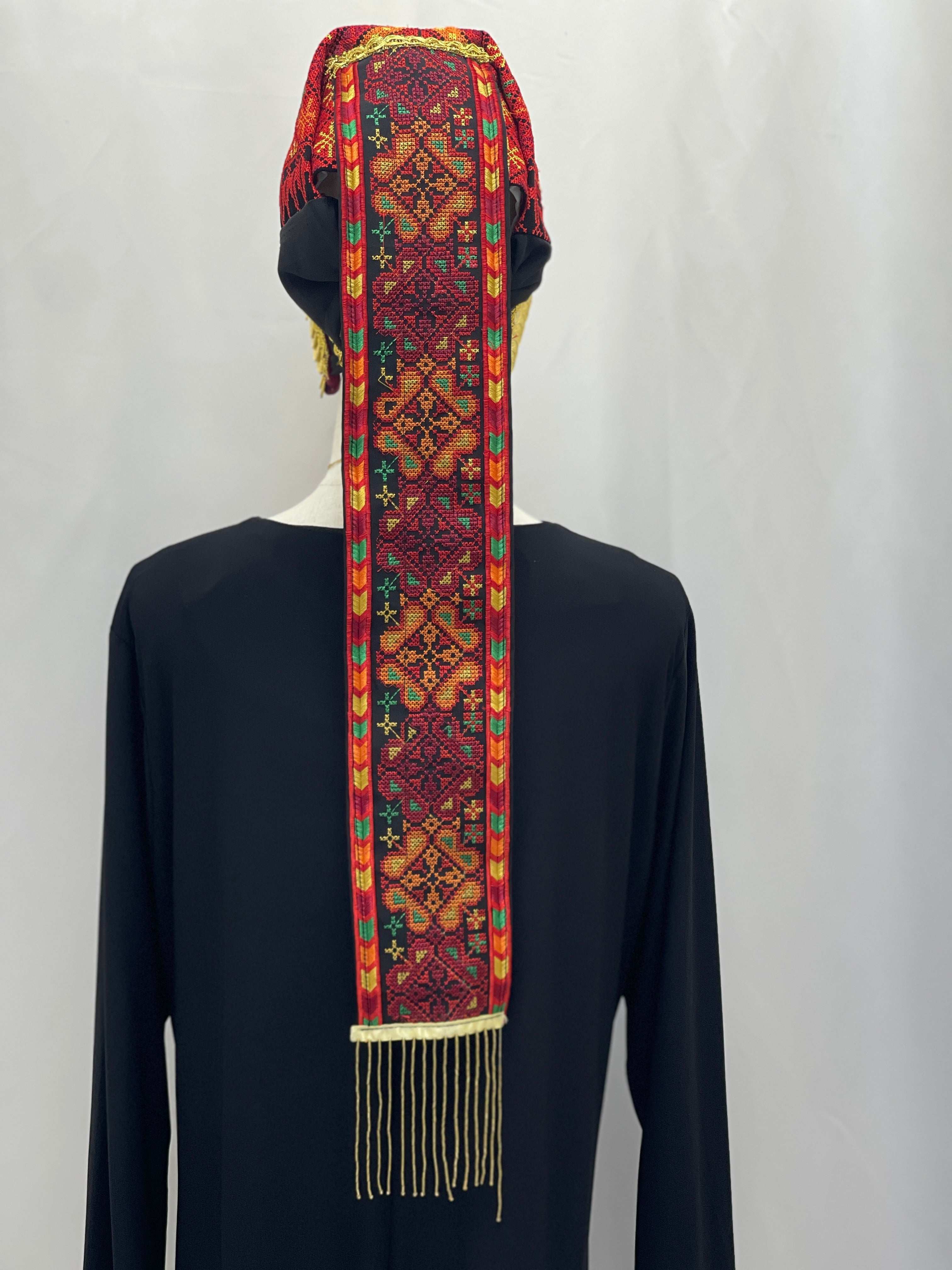 Palestinian Elegance Embroidered Lairs Awka red and gold intricate design lerat with tassels on black background