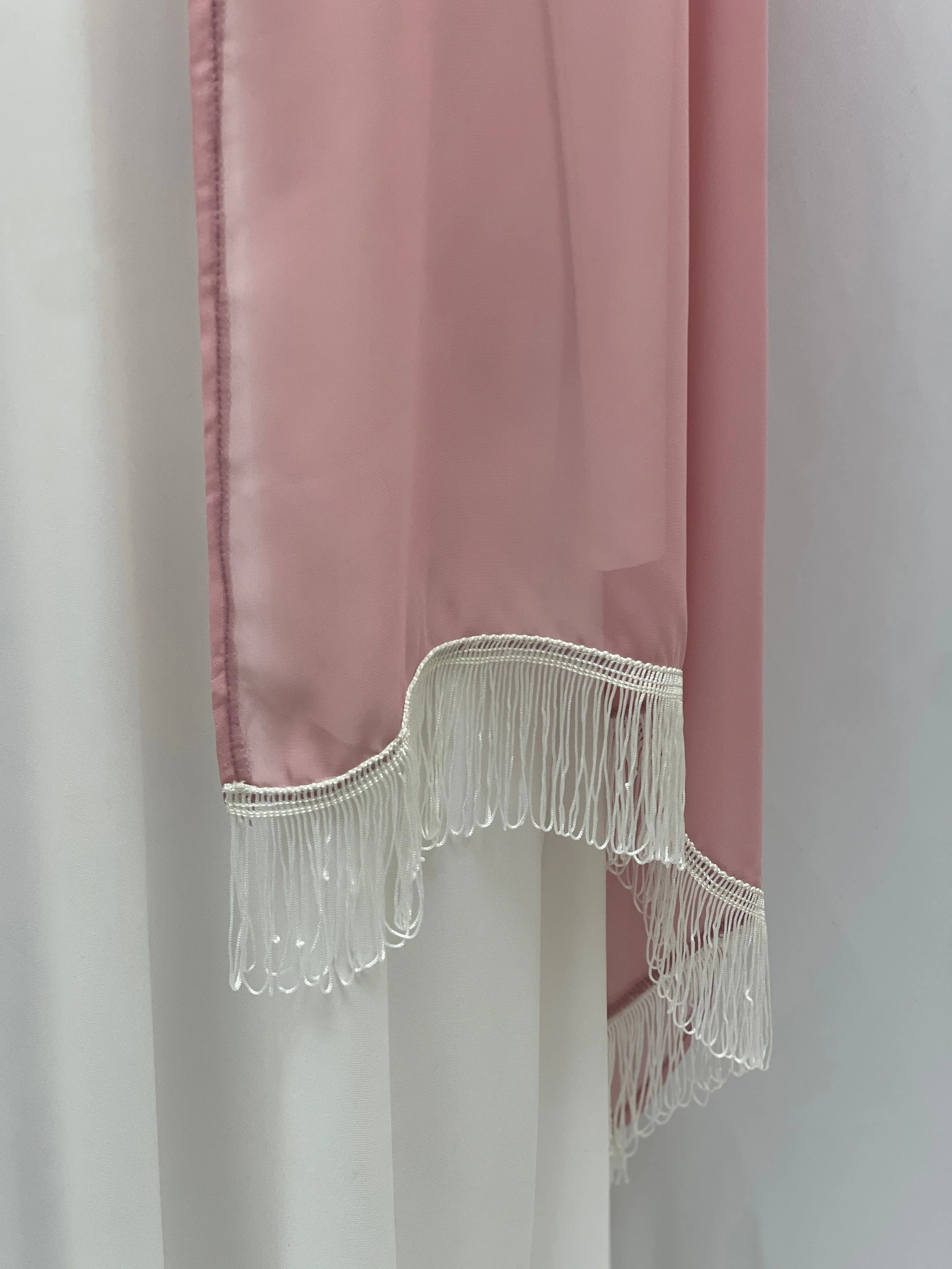 New Khirka With White tassel pink silk robe from Palestinian Elegance showing white fringe hem detail and drape