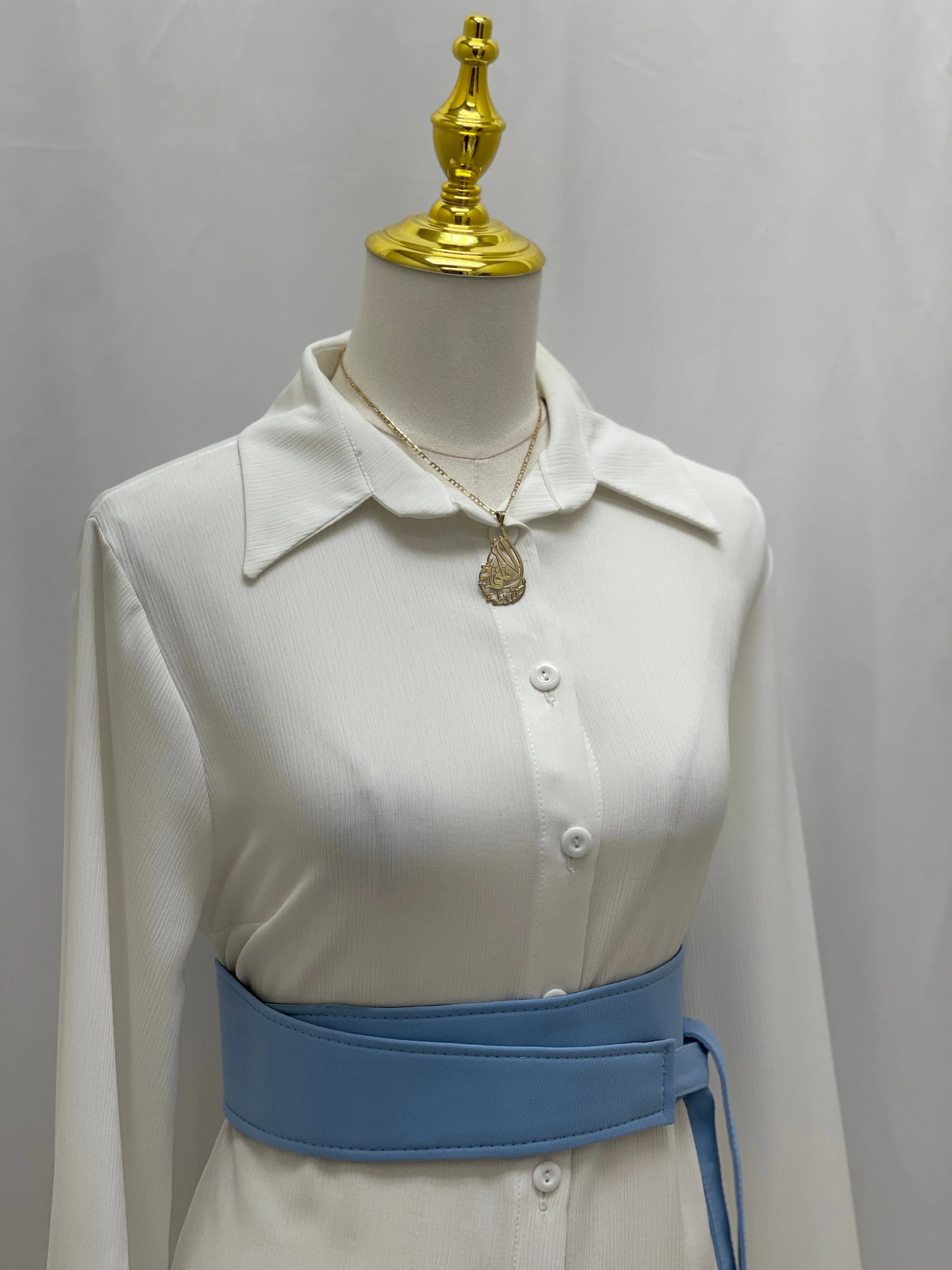 Palestinian Elegance Satin Belt Matt Color sky blue wide waist belt styled over white shirt dress on mannequin