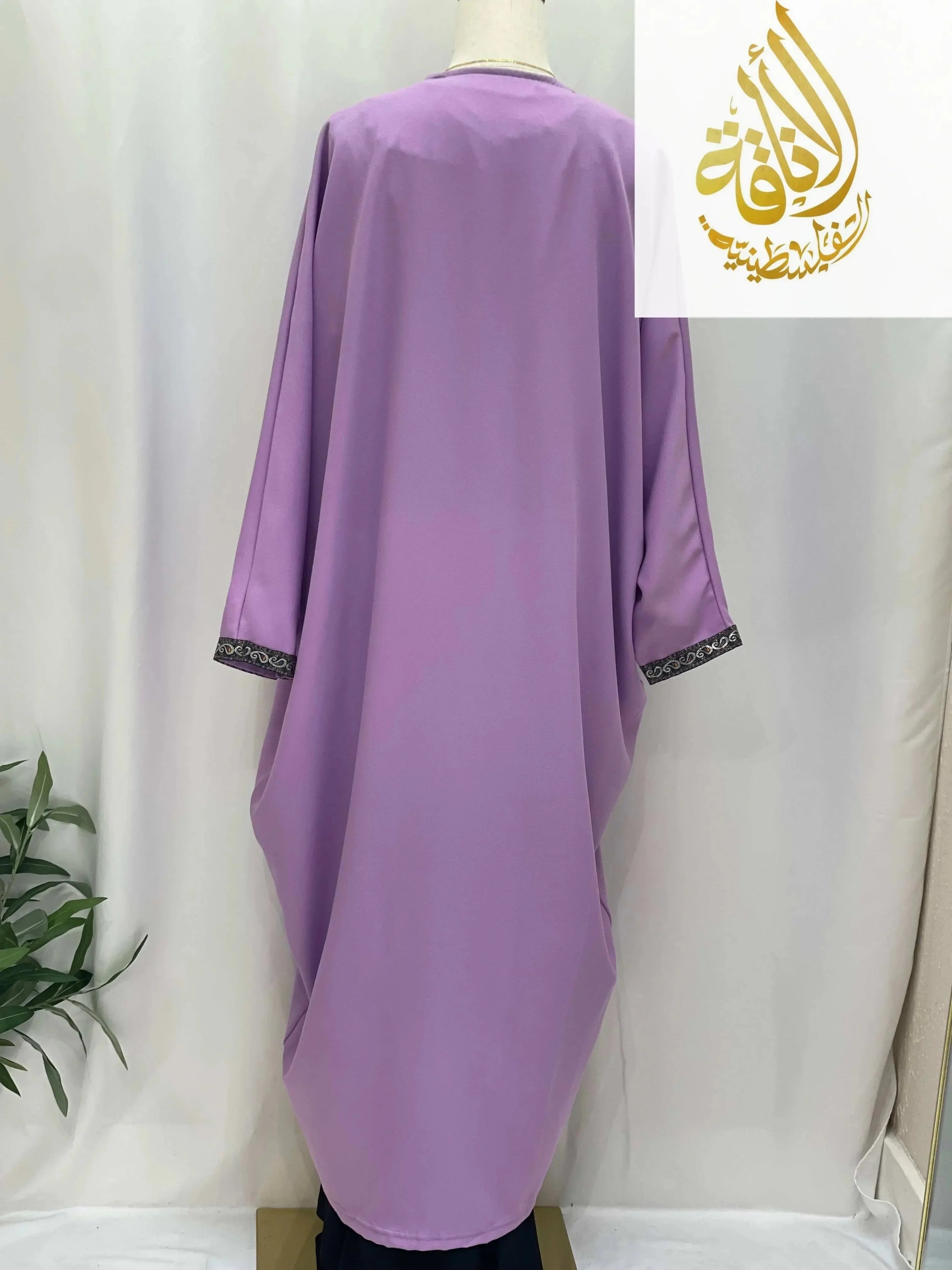 Back view of a lavender Nijma Free Size kimono cardigan by Palestinian Elegance with black embroidered cuffs