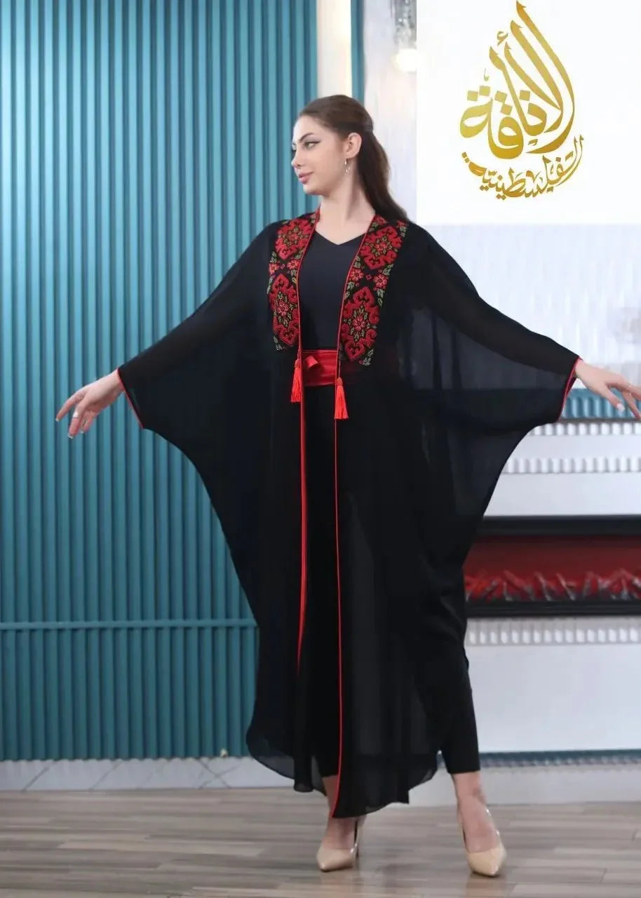 Palestinian Elegance embroidered bisht for women in black with red floral embroidery and flowing sleeves