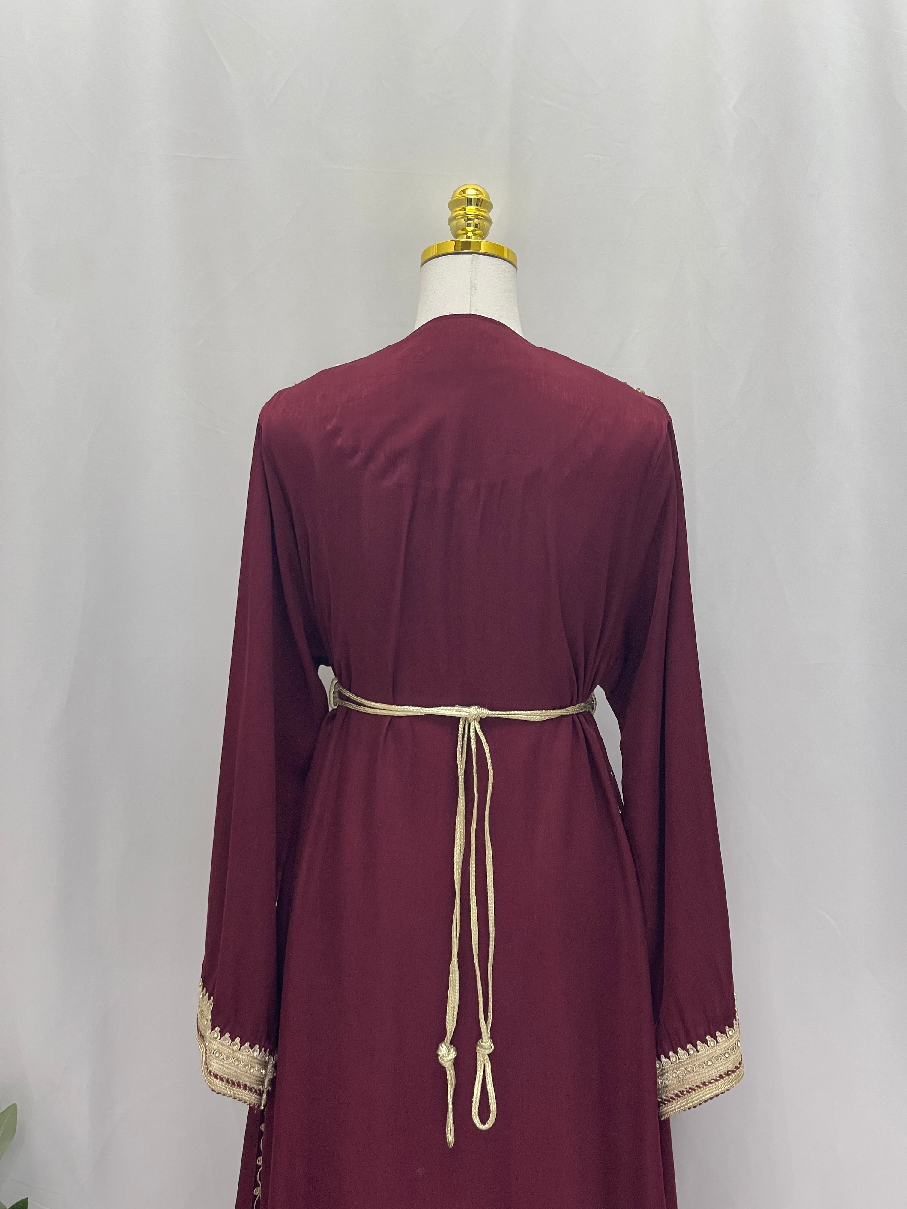 Back view of Omima Morocco Style Kaftan in maroon with beige embroidered cuffs and waist tie