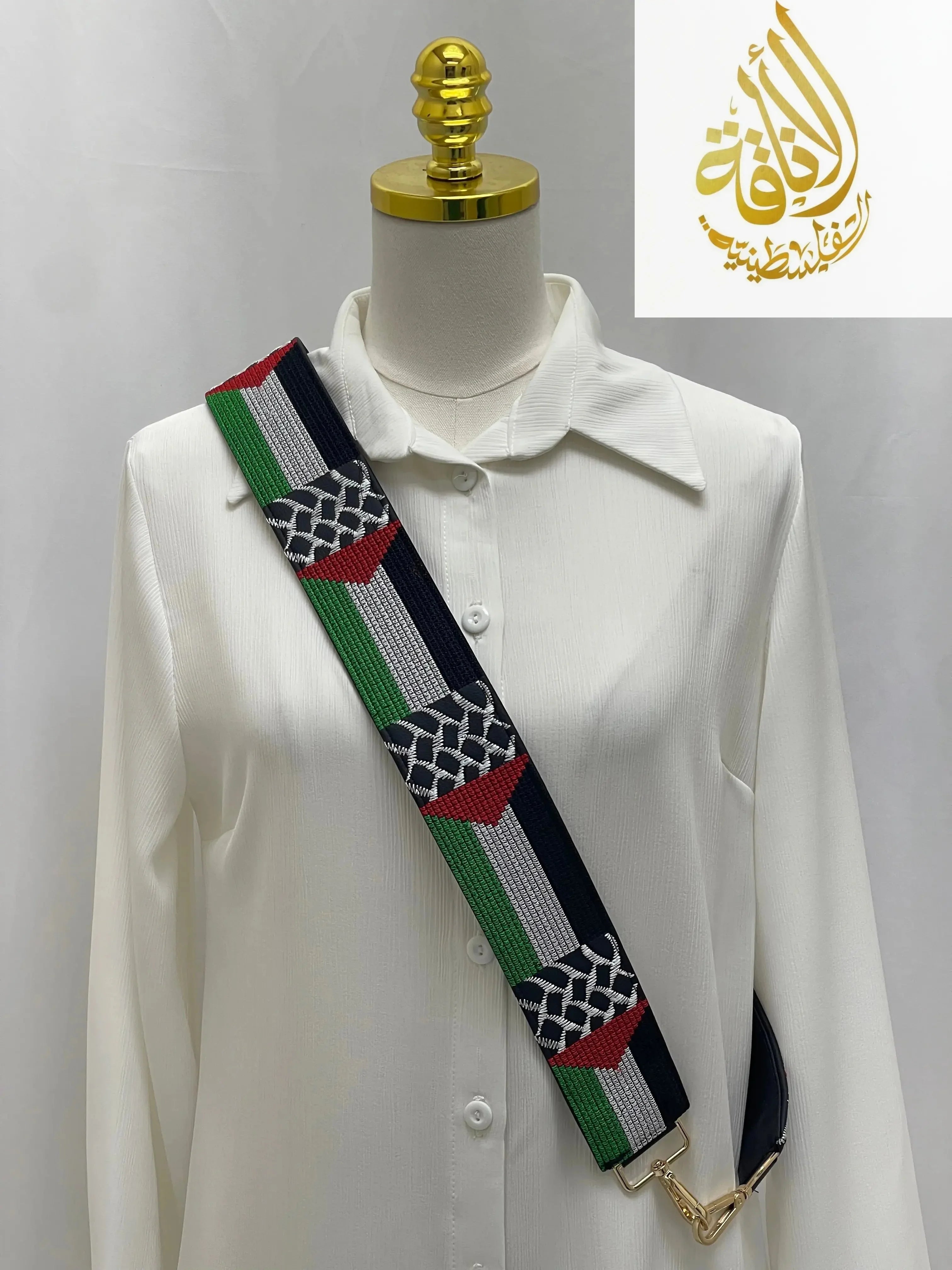 Palestine Embroidered Purse Strap with traditional Palestinian colors and patterns displayed on a white shirt