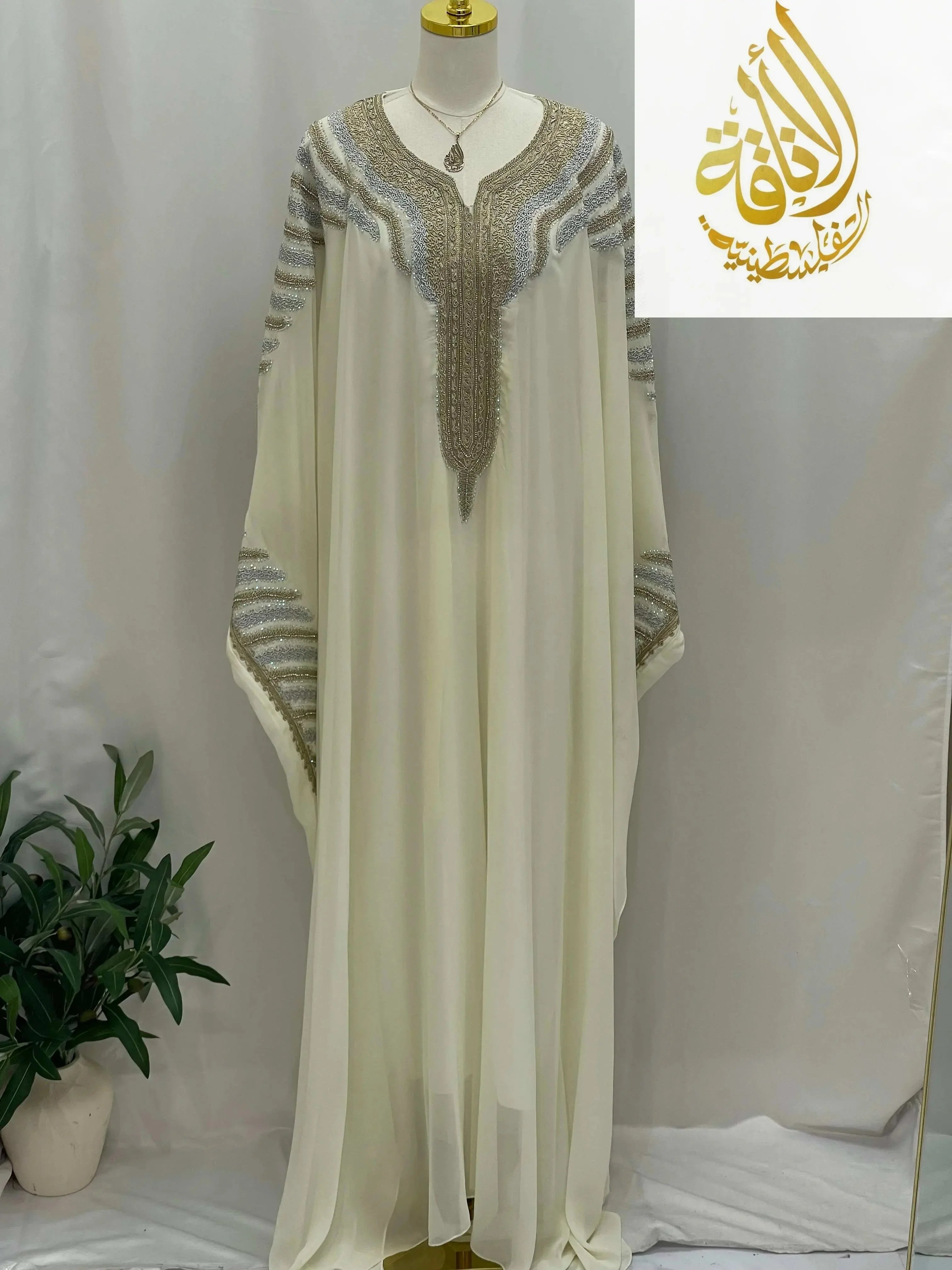 Dana Free Size Kaftan Abaya in cream with intricate silver and gold embroidery by Palestinian Elegance