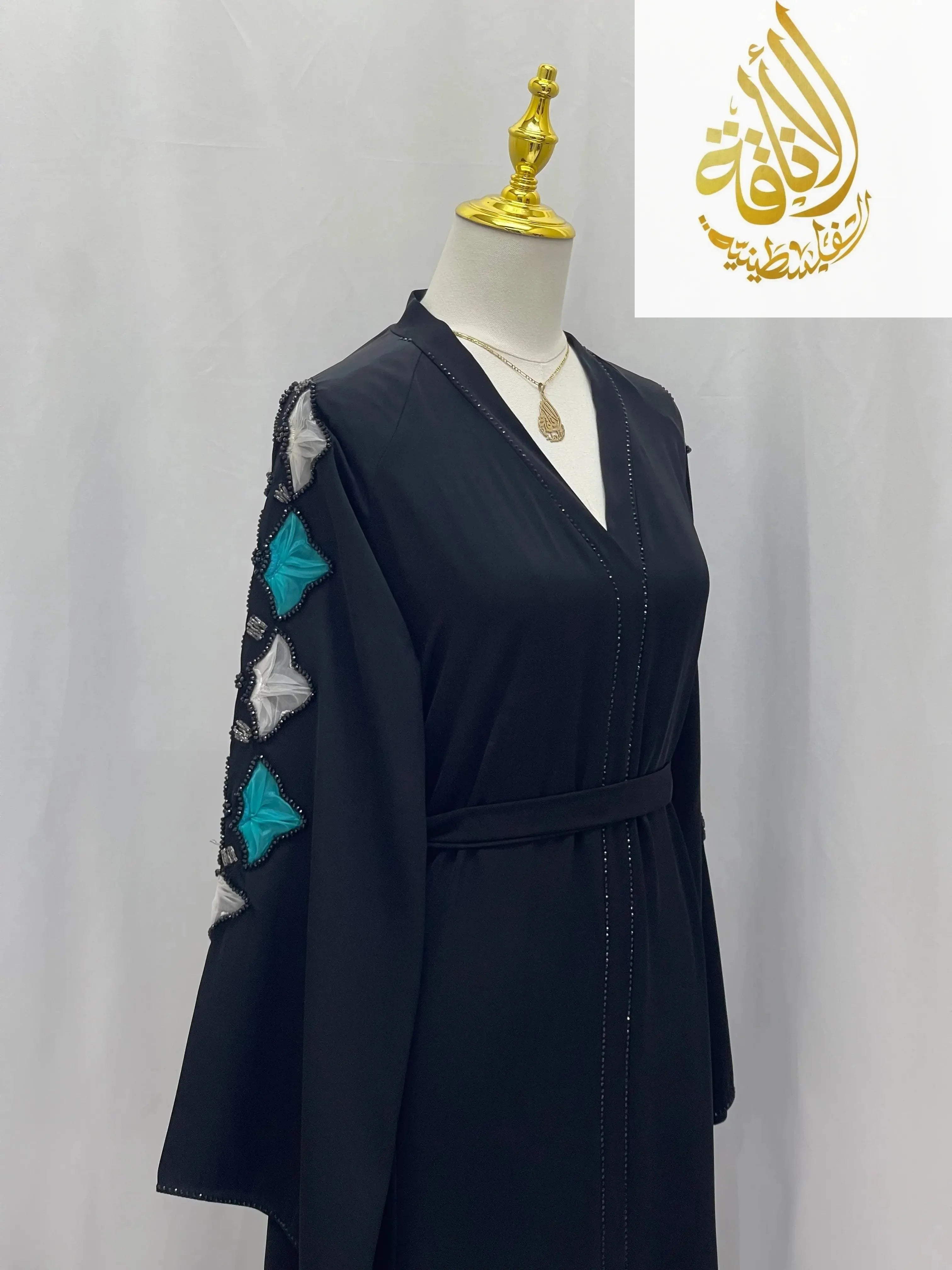 Palestinian Elegance elegant black abaya with decorative blue and silver embroidery on sleeve