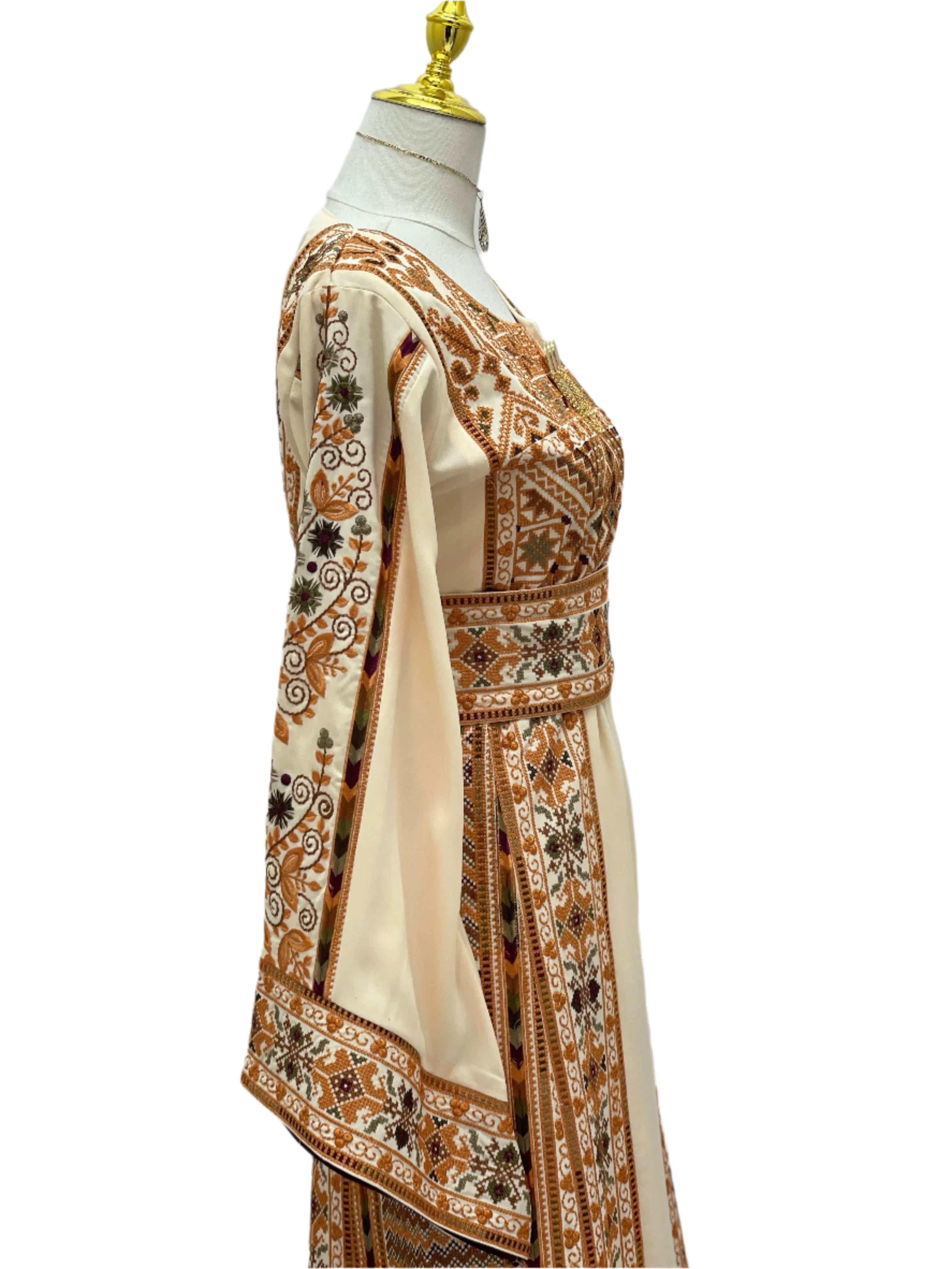 Palestinian Elegance embroidered beige dress with intricate traditional brown and black patterns on sleeves and bodice