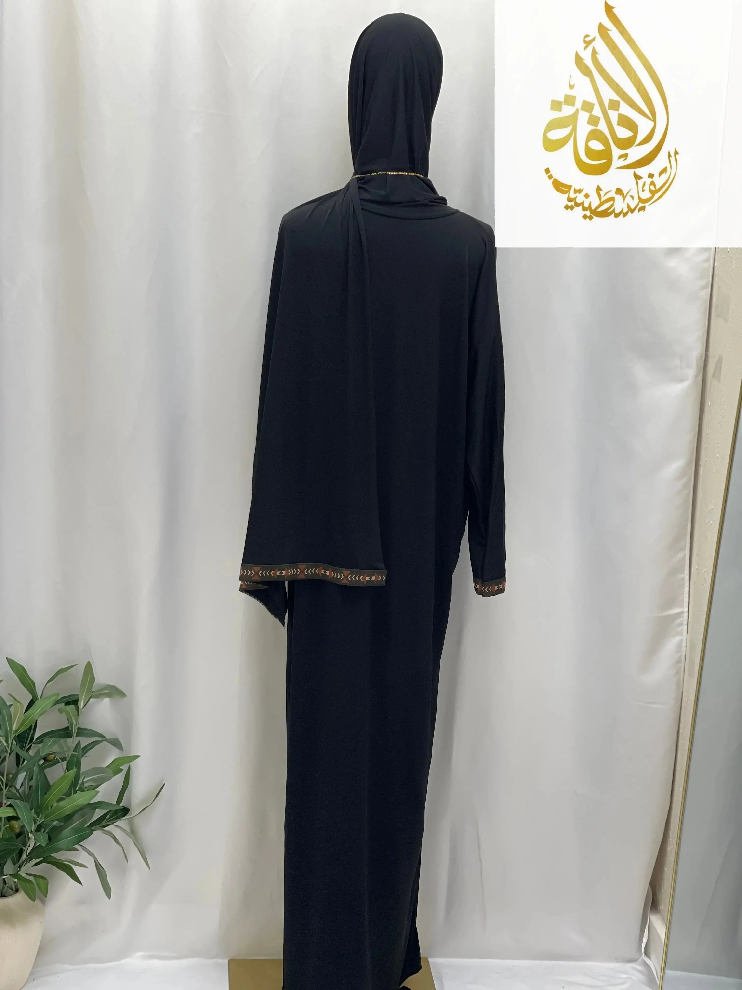Palestinian Elegance black one piece prayer dress abaya with detailed trim on sleeves and hijab