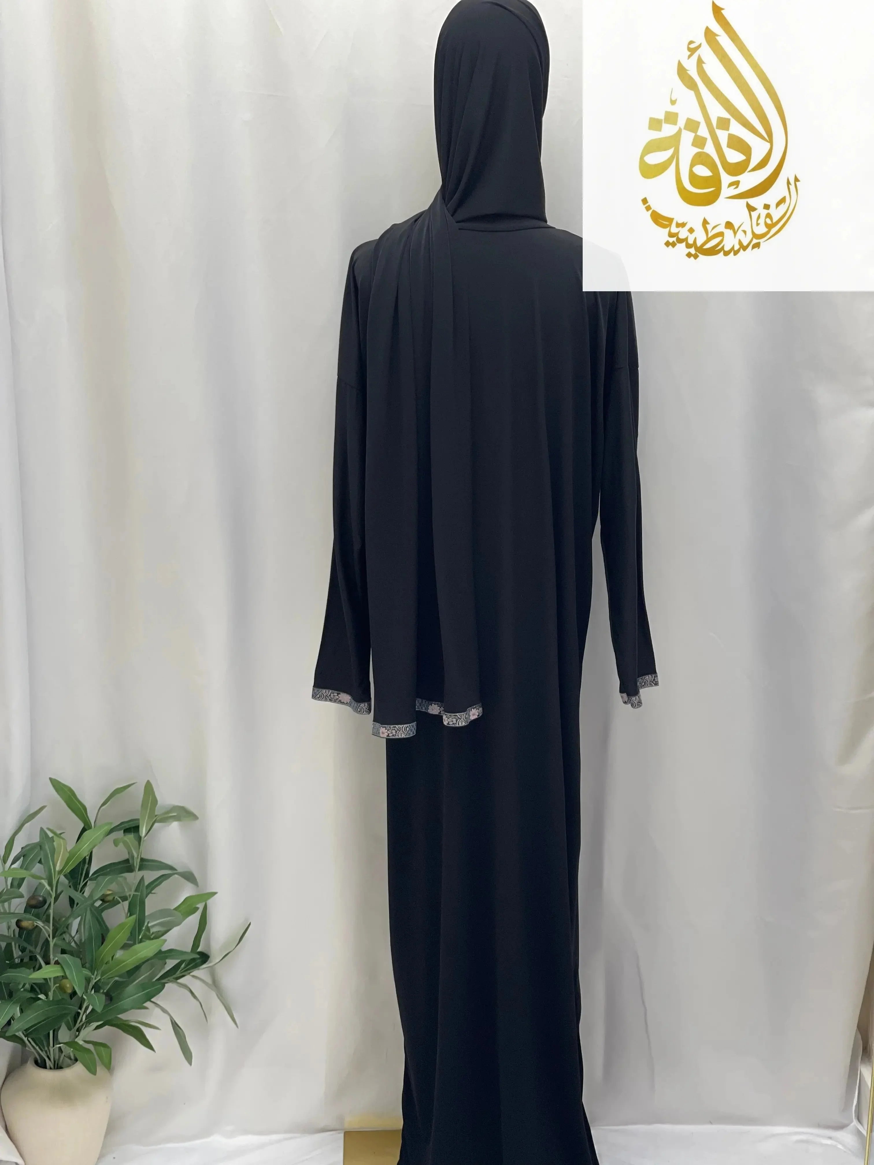 Palestinian Elegance black abaya one piece prayer dress with silver trim on sleeves and hijab