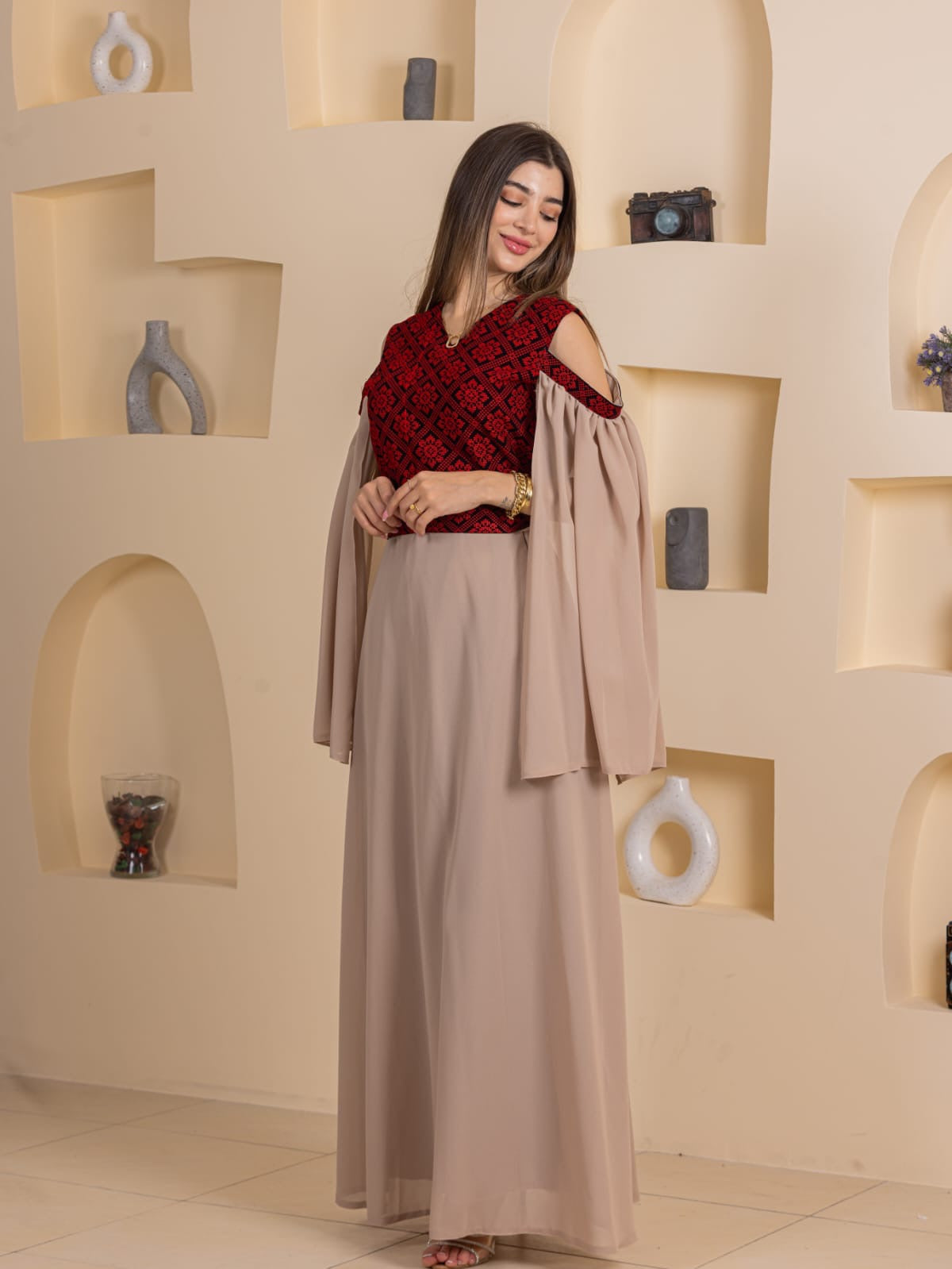 Palestinian Essence Dress by Palestinian Elegance beige long gown with red embroidered bodice and cold shoulder draped sleeves