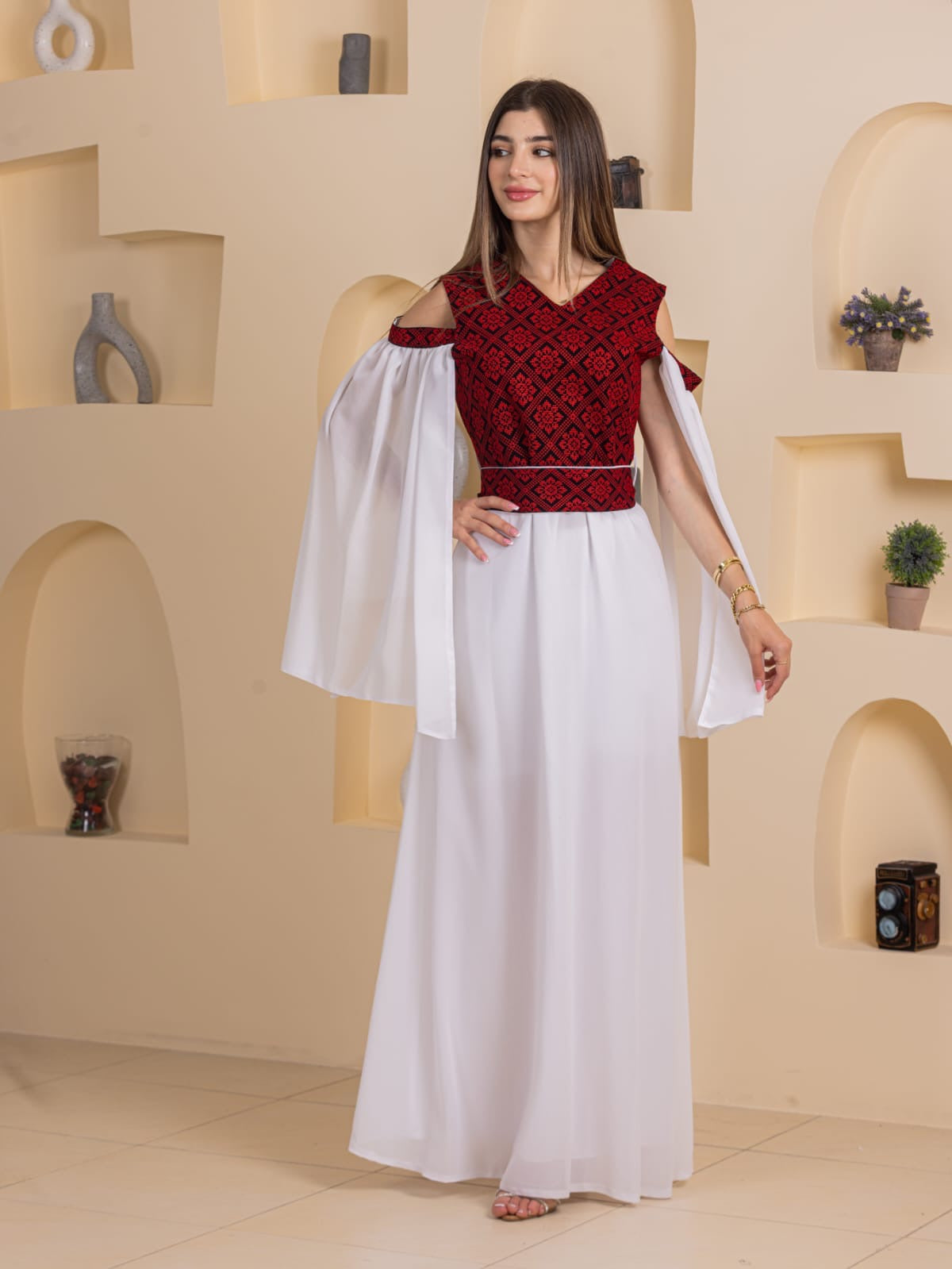 Palestinian Essence Dress by Palestinian Elegance red embroidered with white flowing skirt and cape sleeves