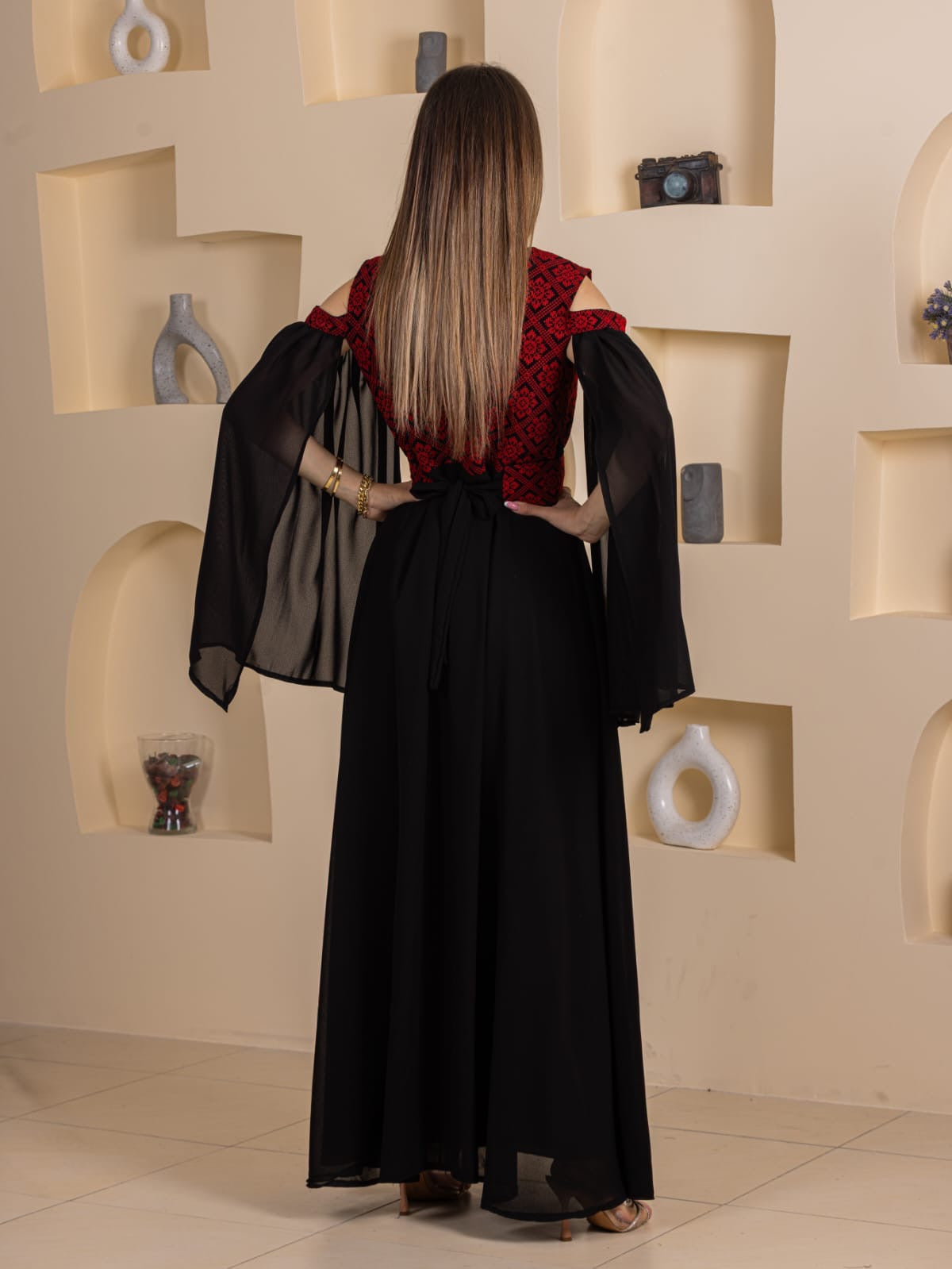Palestinian Essence Dress long black skirt with red embroidered bodice and sheer bell sleeves back view
