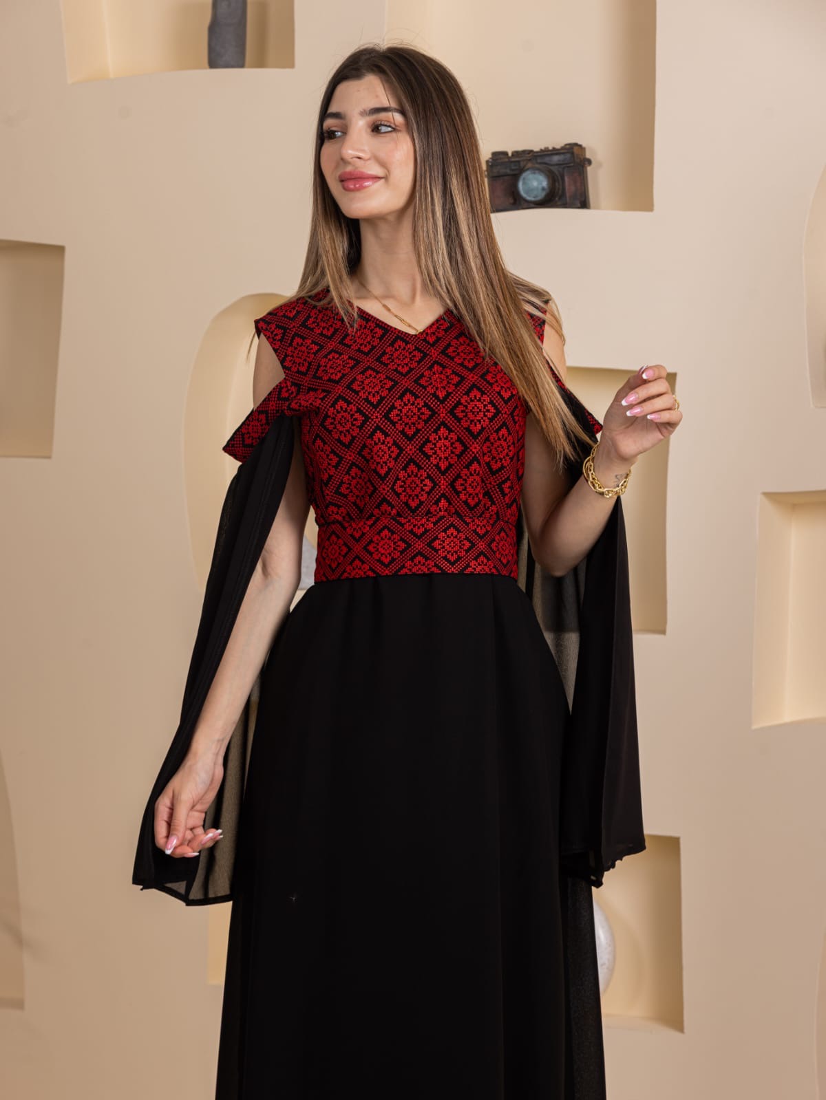 Palestinian Essence Dress by Palestinian Elegance red embroidered bodice black flowing skirt cape sleeves