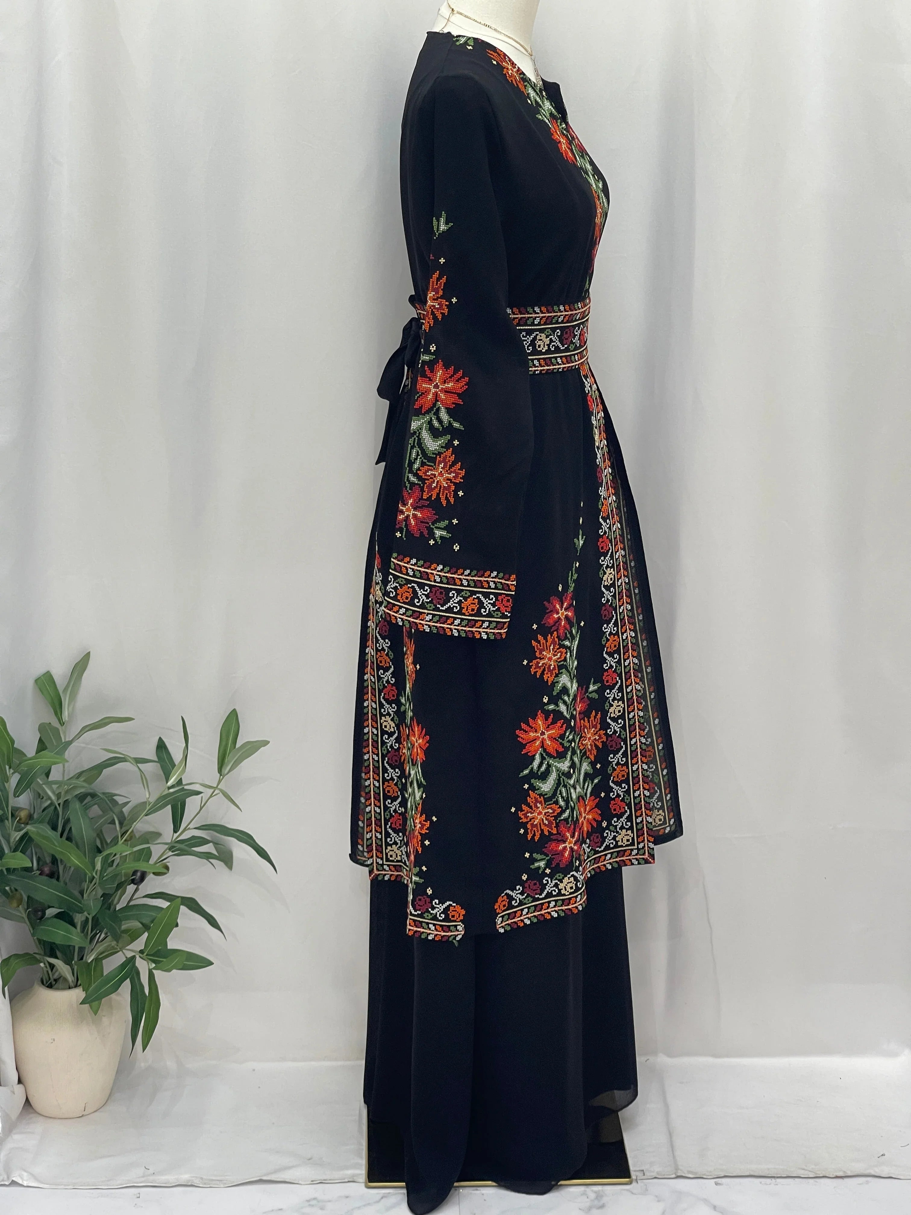 Elegant Rose Embroidered Dress Abaya in black with vibrant floral designs and a tied waist
