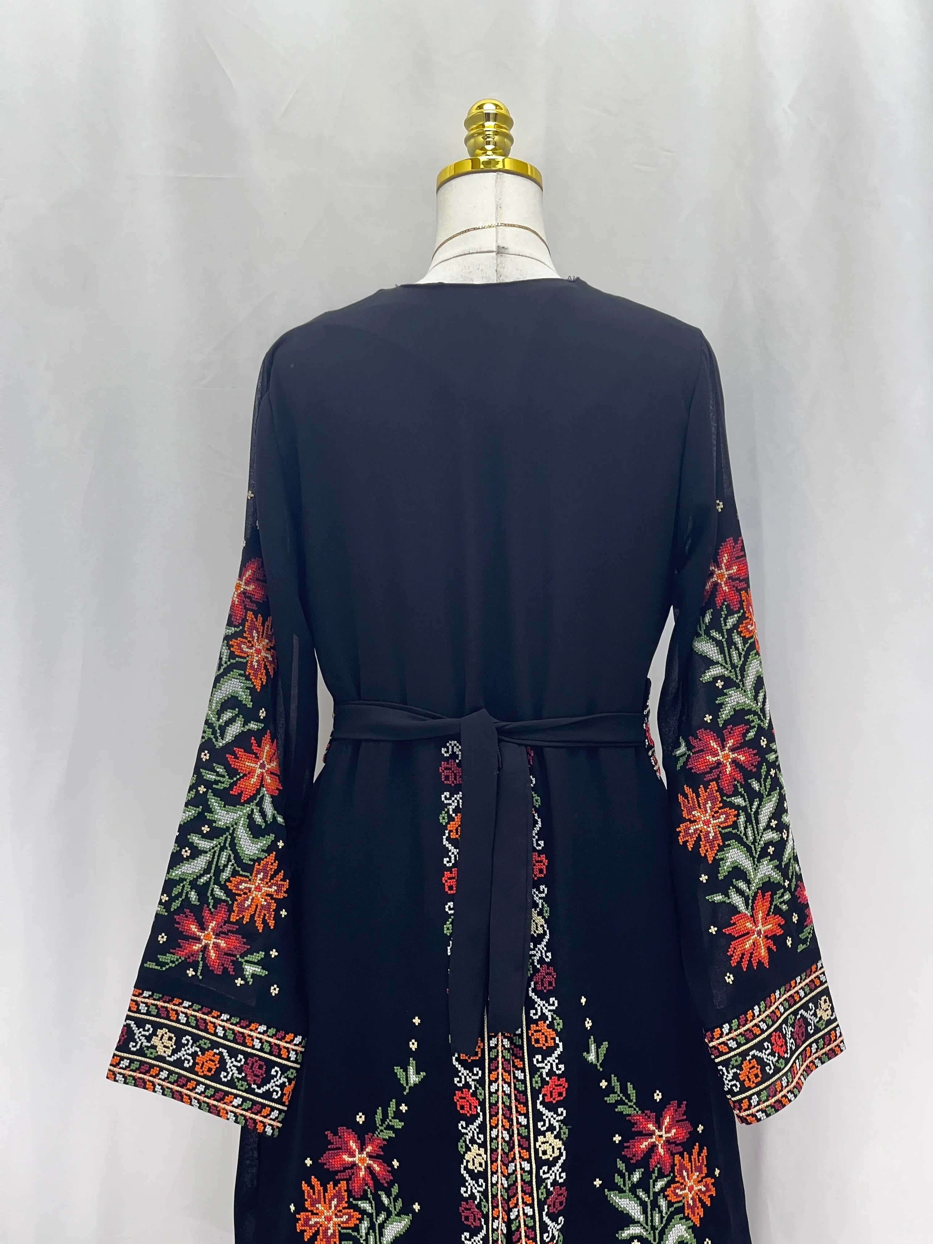 Back view of the Rose Embroidered Dress Abaya featuring colorful floral embroidery and a stylish belt