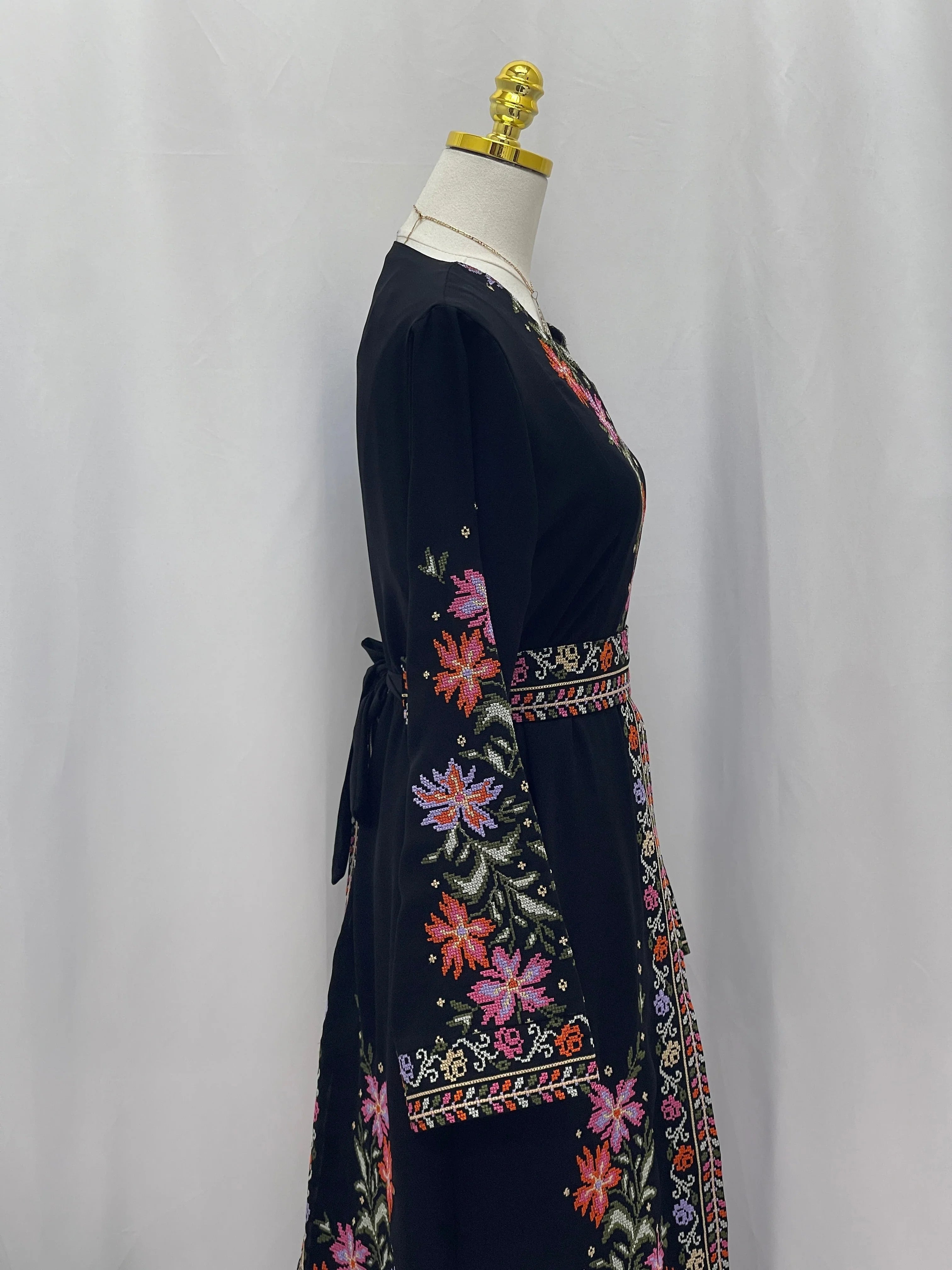 Elegant Rose Embroidered Dress Abaya featuring vibrant floral designs and a stylish silhouette