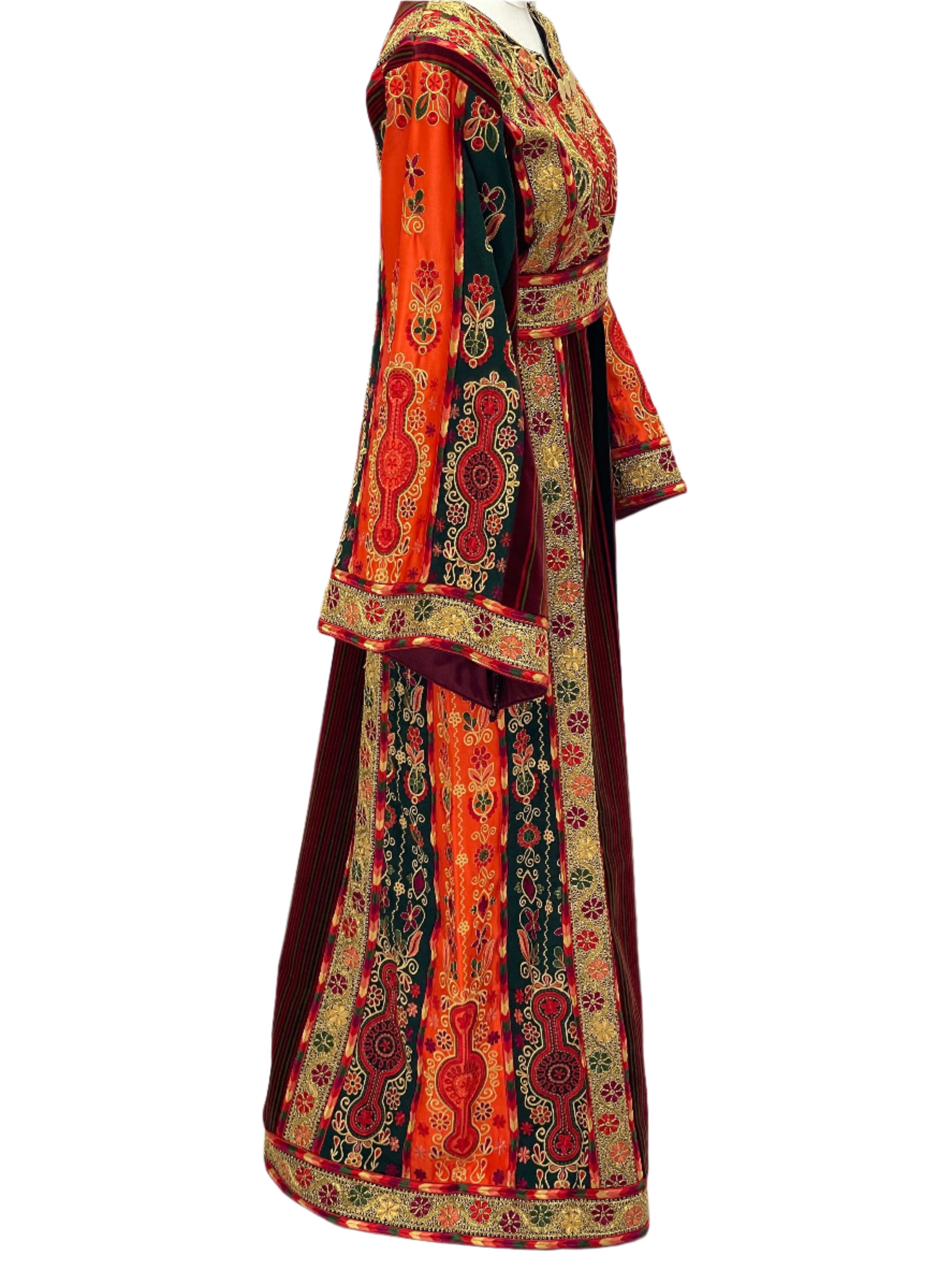 Embroidered Janna & Nar Malaka Kasab Thoub dress by Palestinian Elegance with vibrant orange and green patterns